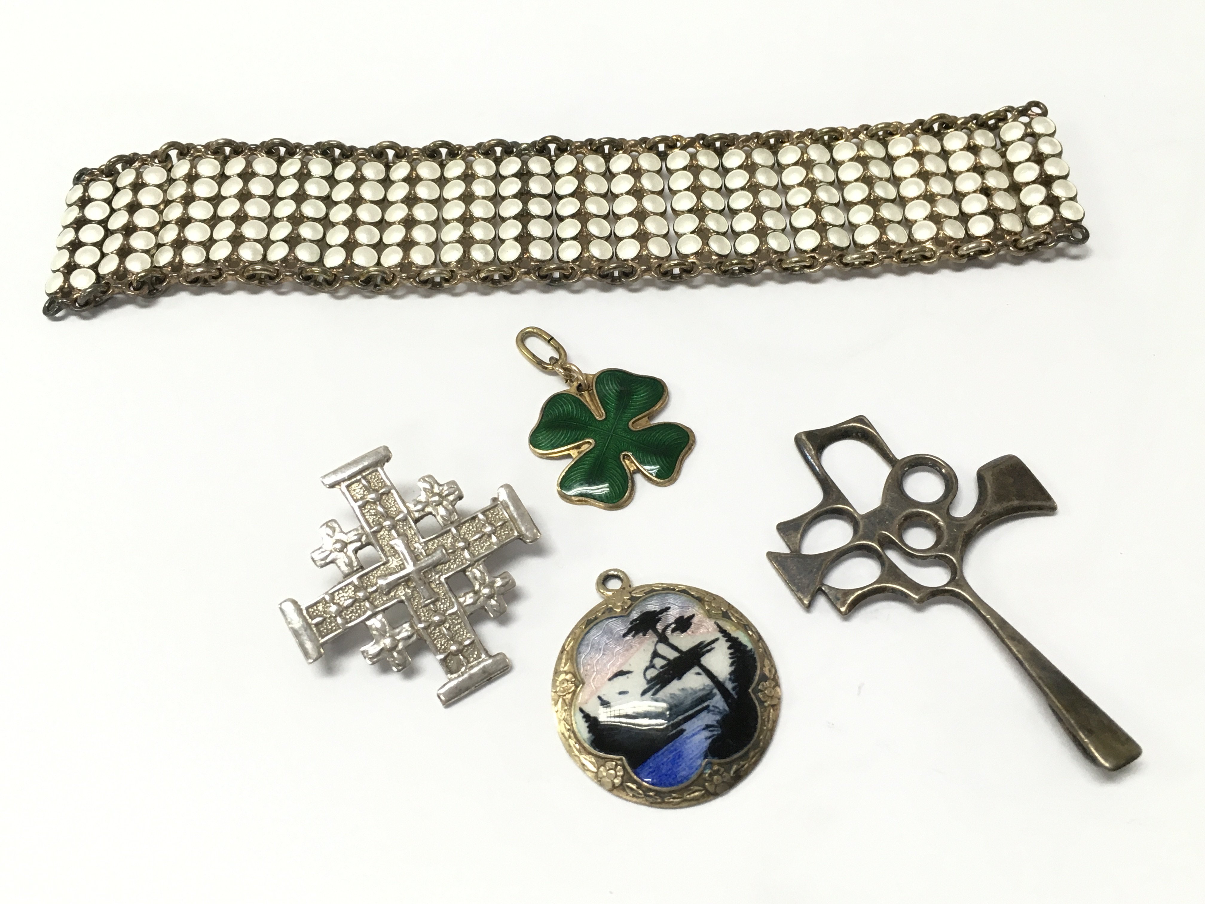 A silver and enamel Norwegian bracelet (damaged) , silver Norwegian pendant , silver Irish clover, silver Jerusalem pin. Postage category A
