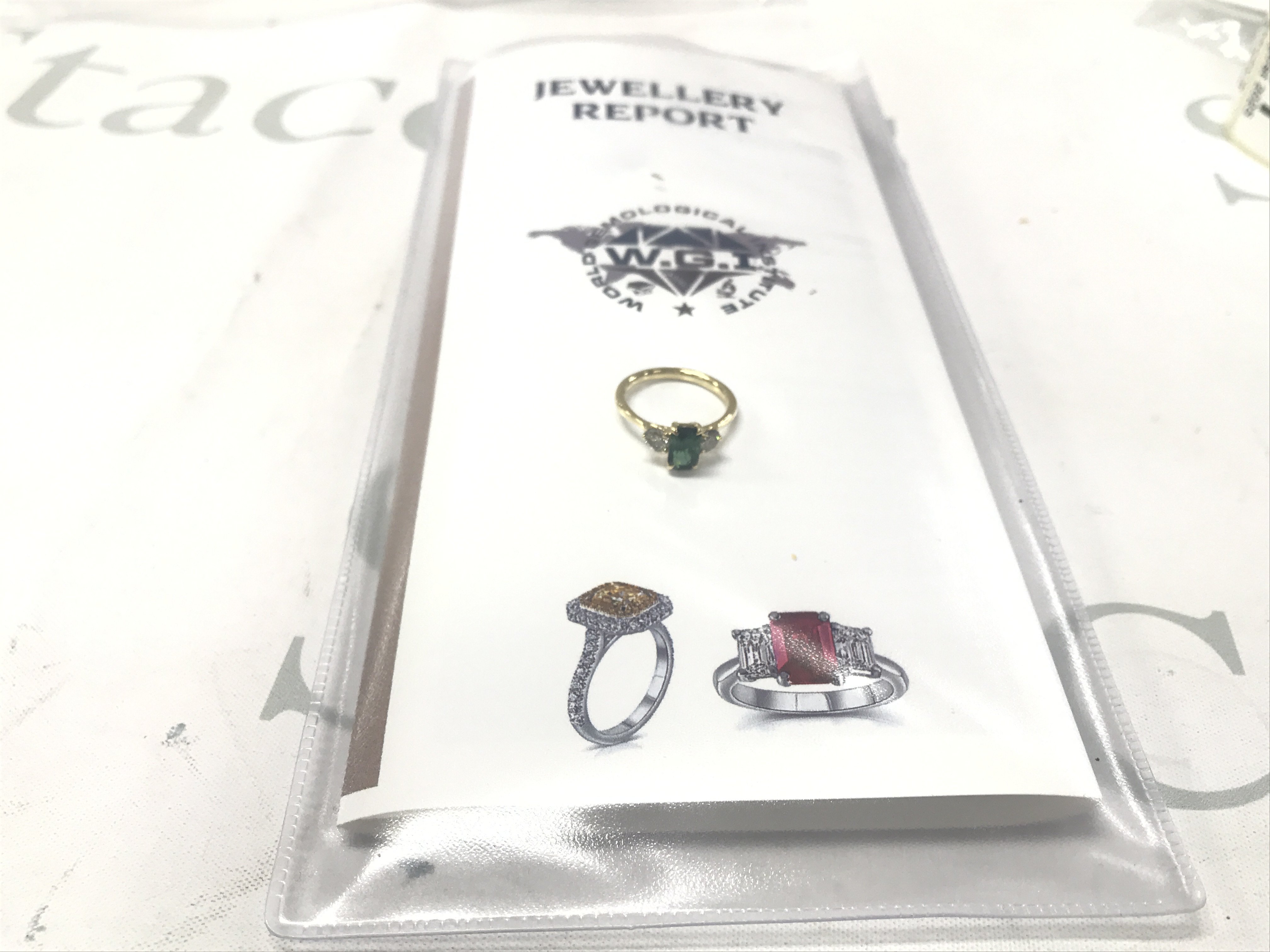 Certificated 18ct yellow gold green tourmaline and RBC diamond 3-stone ring. Octagonal step-cut tourmaline 1.33ct. Diamonds 0.58ct. Cert no. WGI9634162214