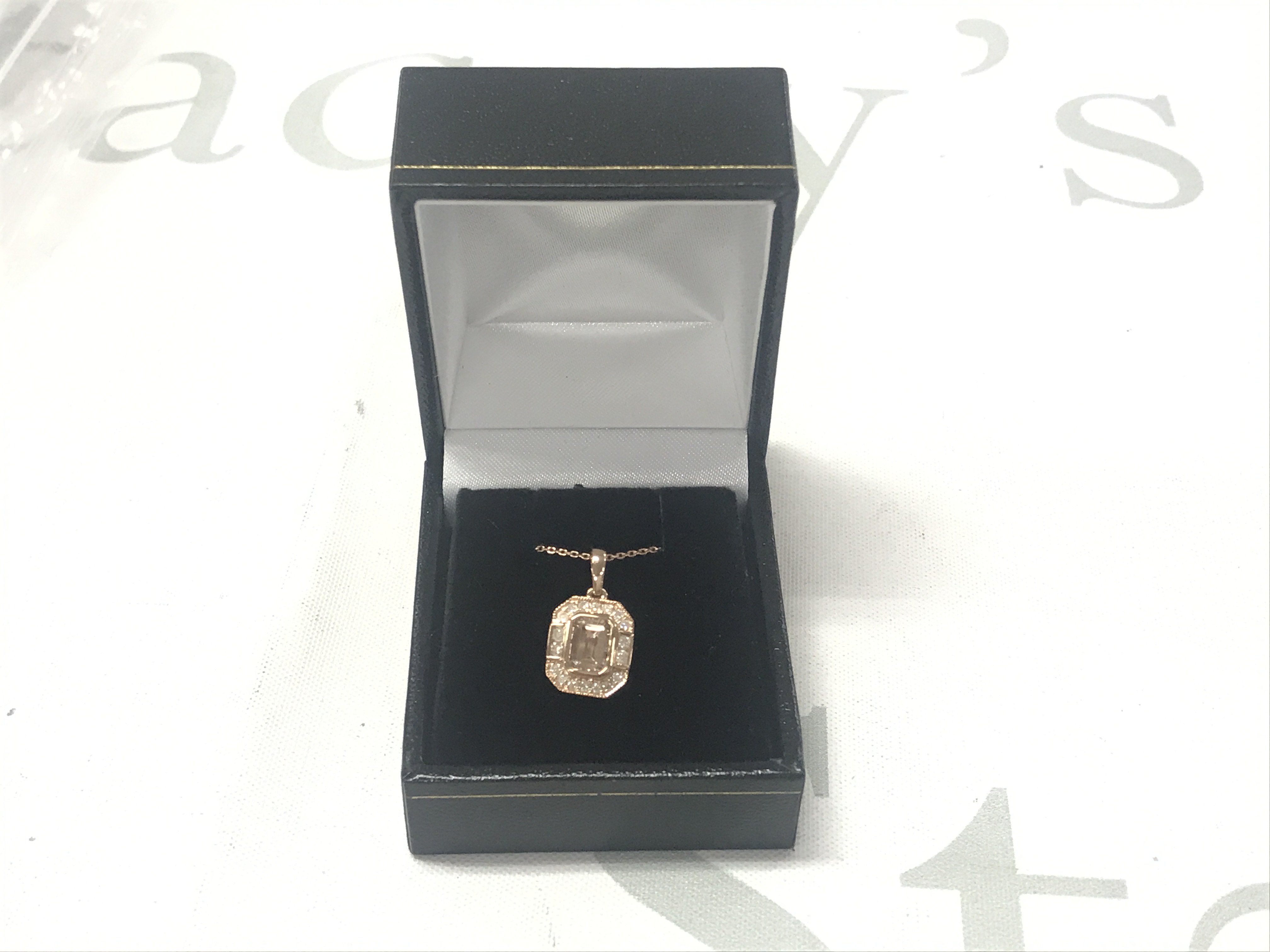 9ct rose gold tea-cut morganite and RBC diamond Art Decostyle cluster pendant on a 9ct rose gold chain, boxed. Morganite 0.92ct. Diamonds 0.23ct.