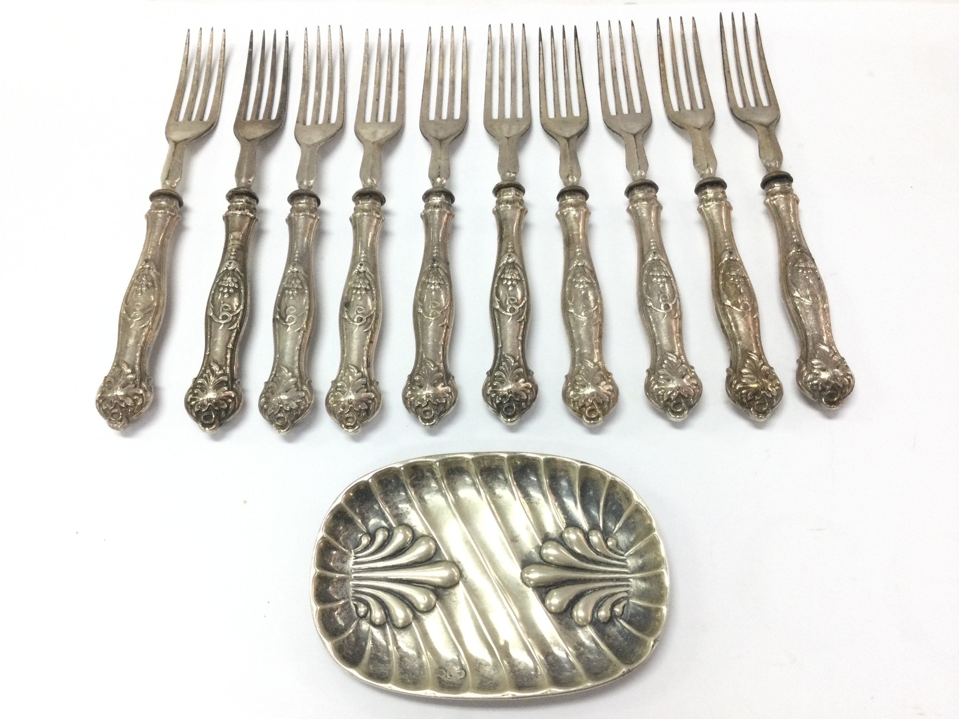 Ten hallmarked silver handled forks and a silver pin tray . Postage category b