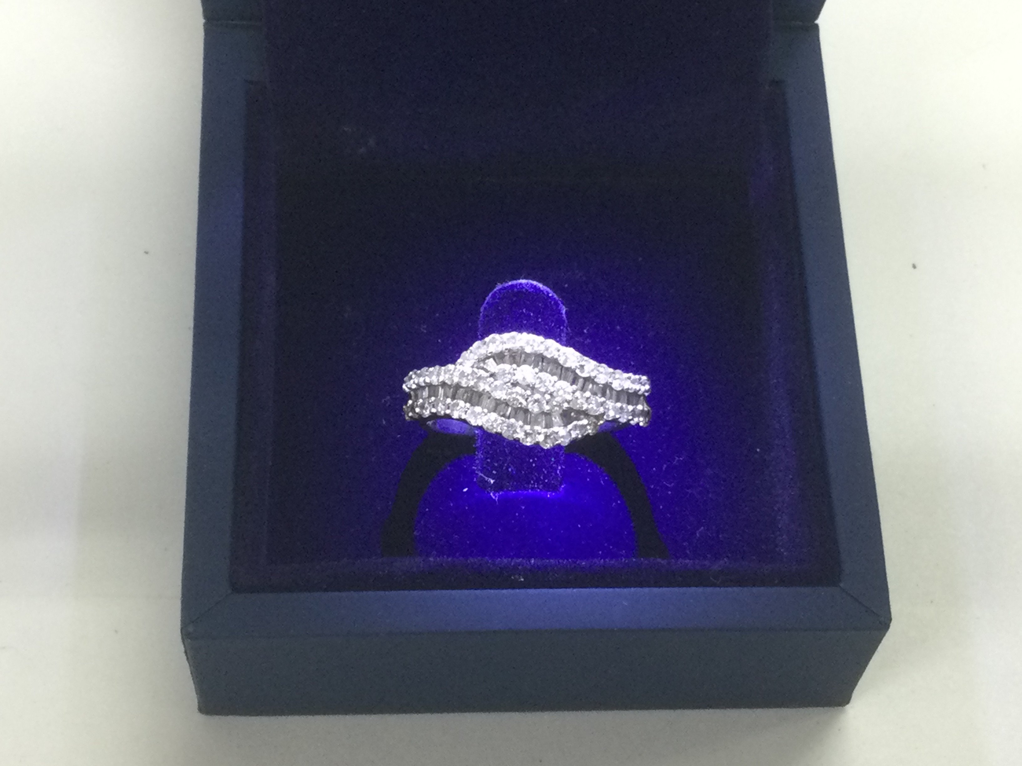 A 9ct white gold diamond set ring, approx 5.4g and approx size N. Shipping category B.