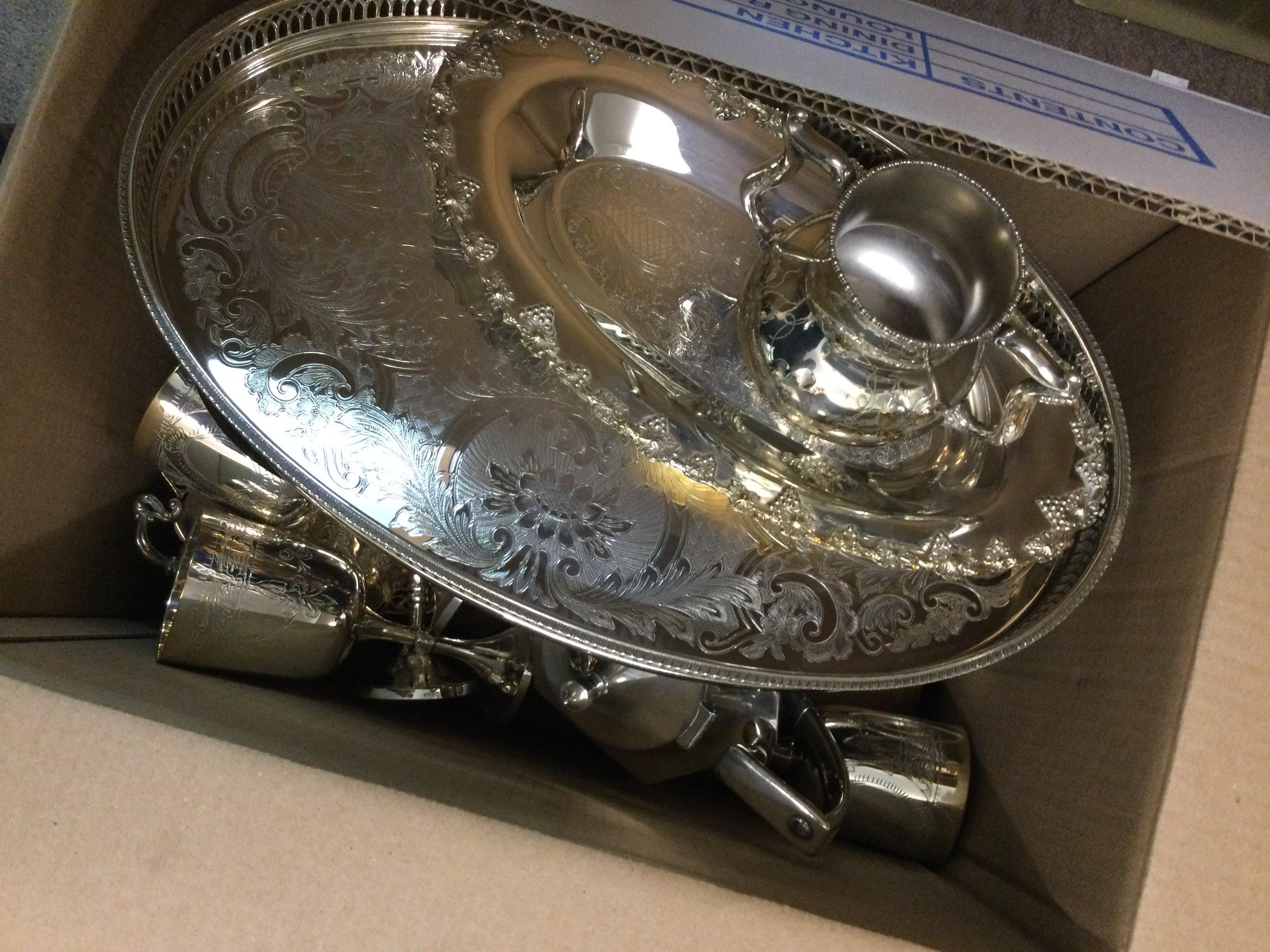 A box containing silver plated ware various and a canteen of cutlery,