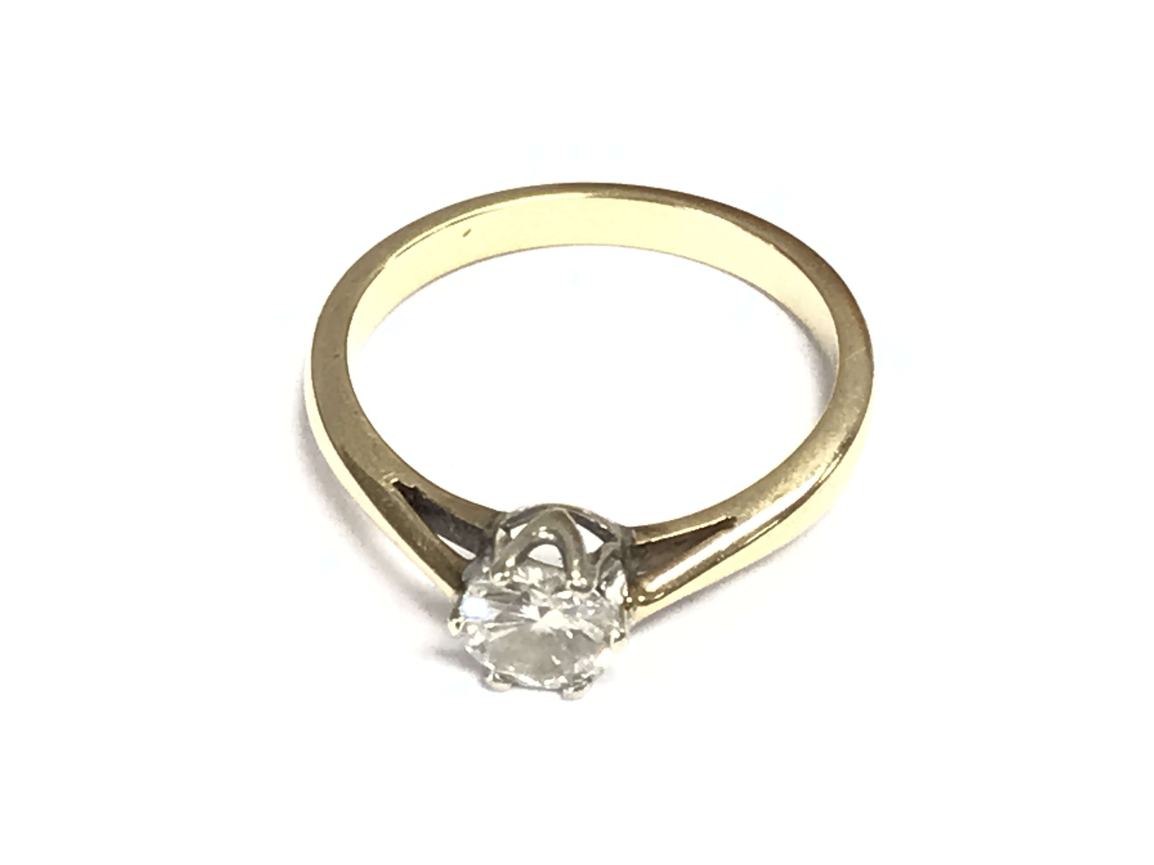 An unmarked 18ct gold ring set with solitaire diamond which is approximately 0.85ct. Size O 1/2. Postage B