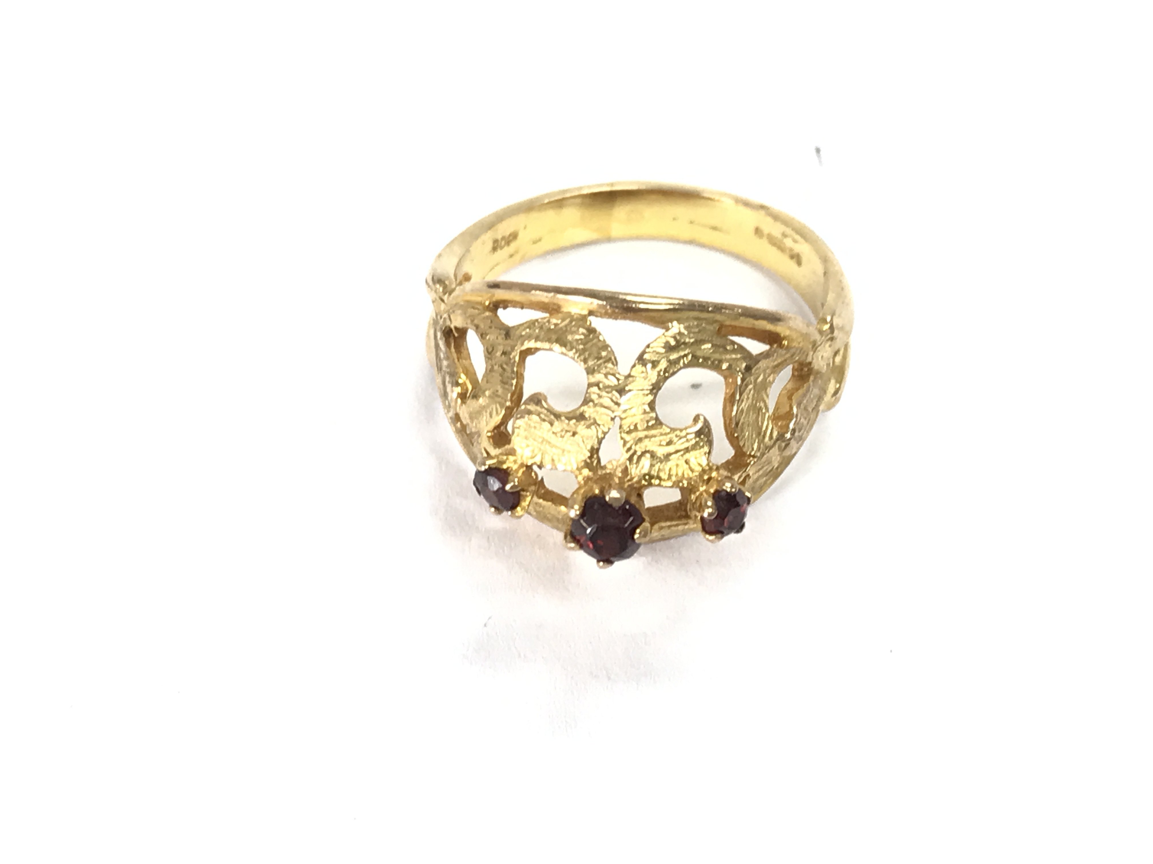 A 9ct gold ring set with rubys. Size O and 4.37g Postage A