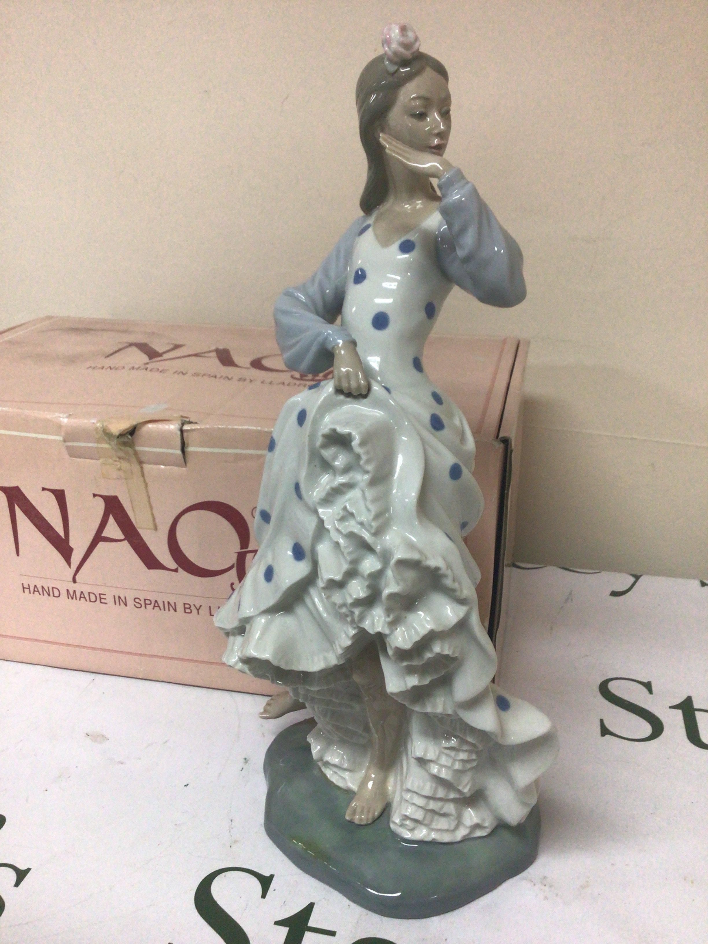 A Porcelain NAO Spanish figure of a dancing girl Hight 37cm. No obvious damage.