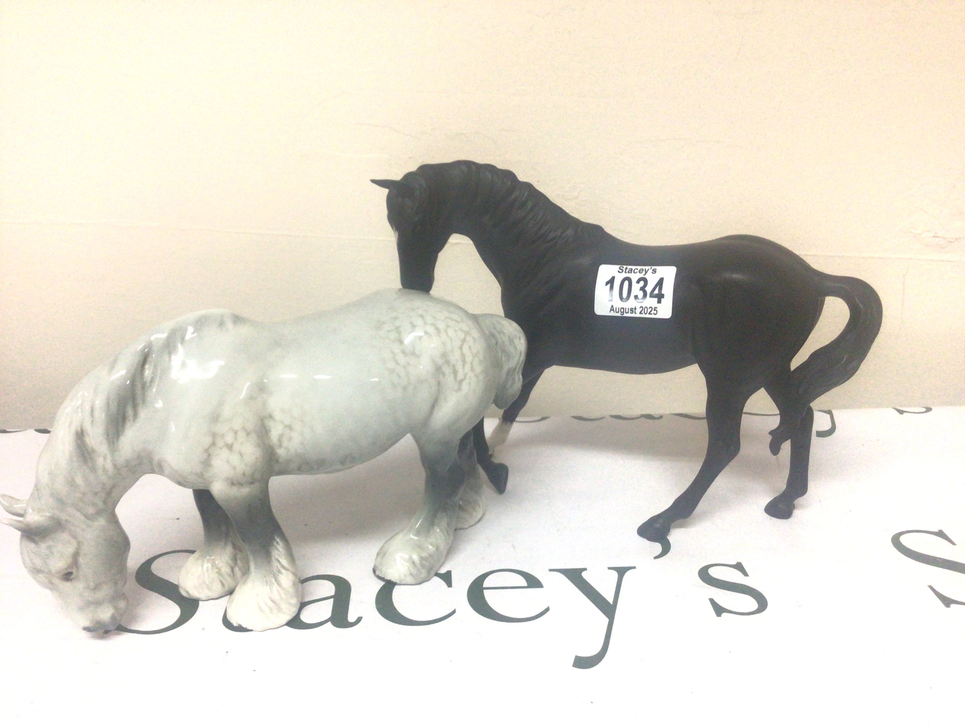 Two Beswick horses a Dapple Grey heavy horse and Matt finish black horse no obvious damage (2)