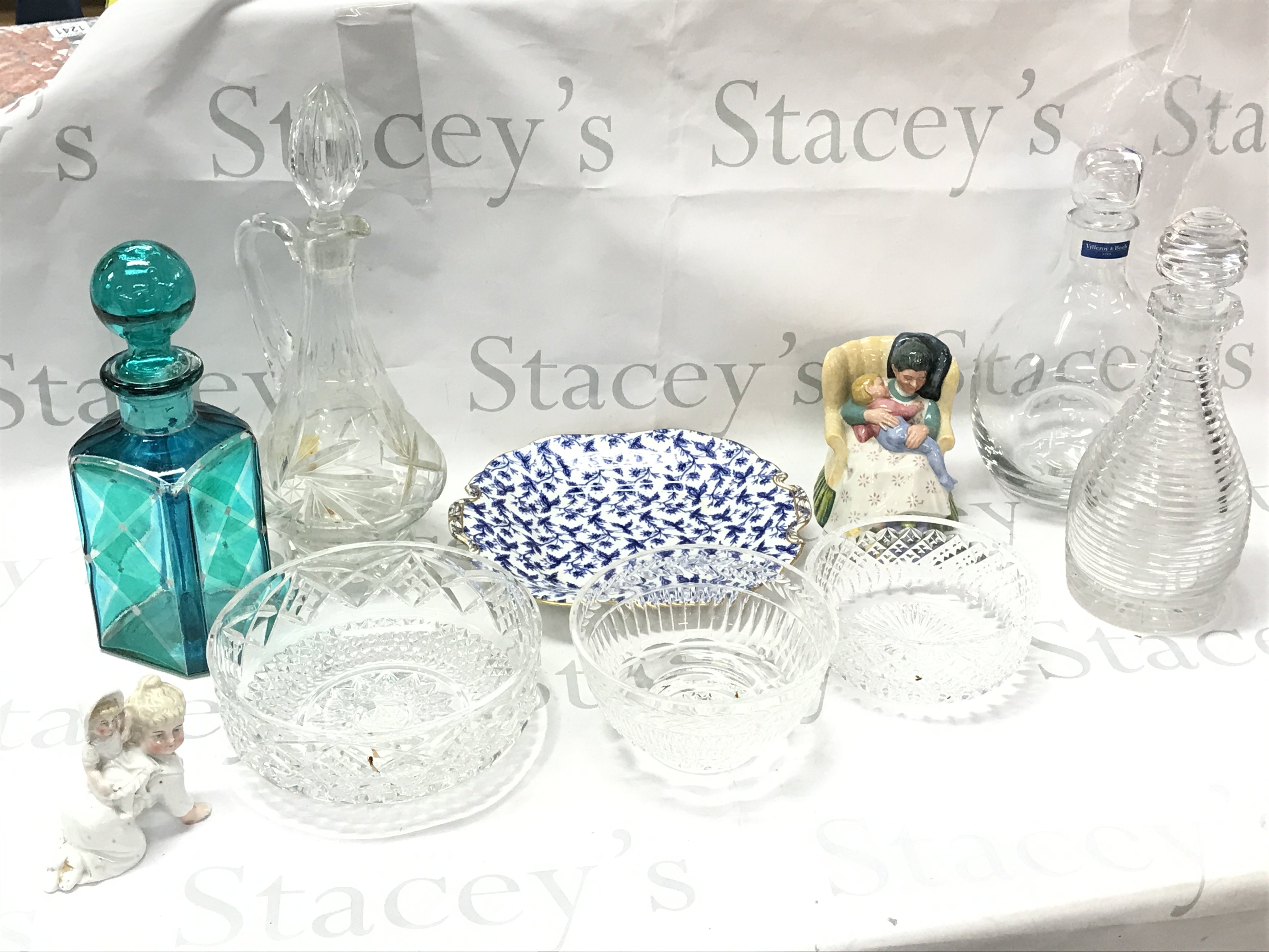 A collection of cut glass decanters and bowls including a Villeroy & Boch decanter, Royal Doulton Sweet dreams figure, Victorian Minton blue floral plate. This lot cannot be posted
