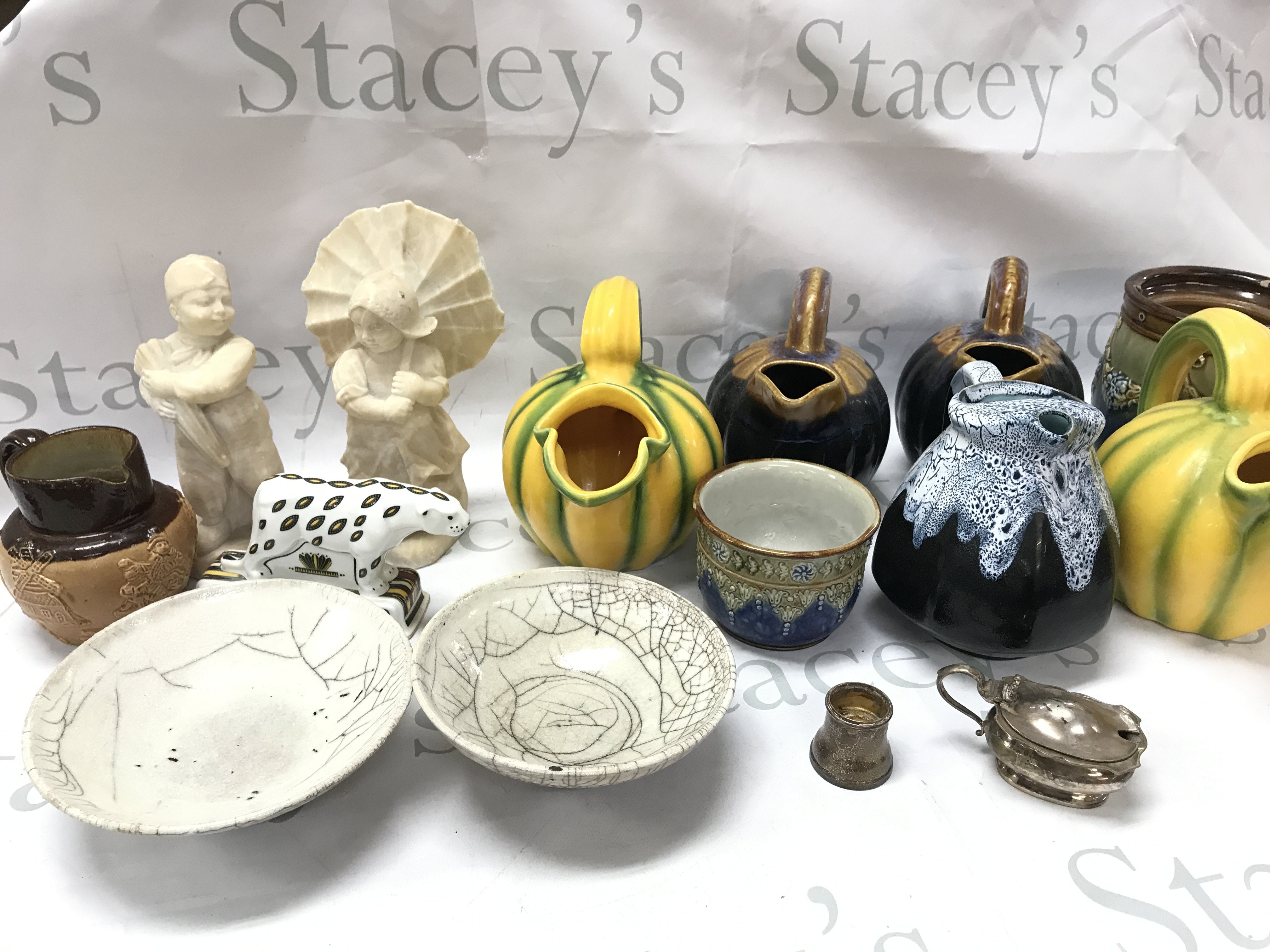 A collection of ceramics Royal Doulton lambeth vases , Wedgwood Noahs ark panther, French jugs. This lot cannot be posted