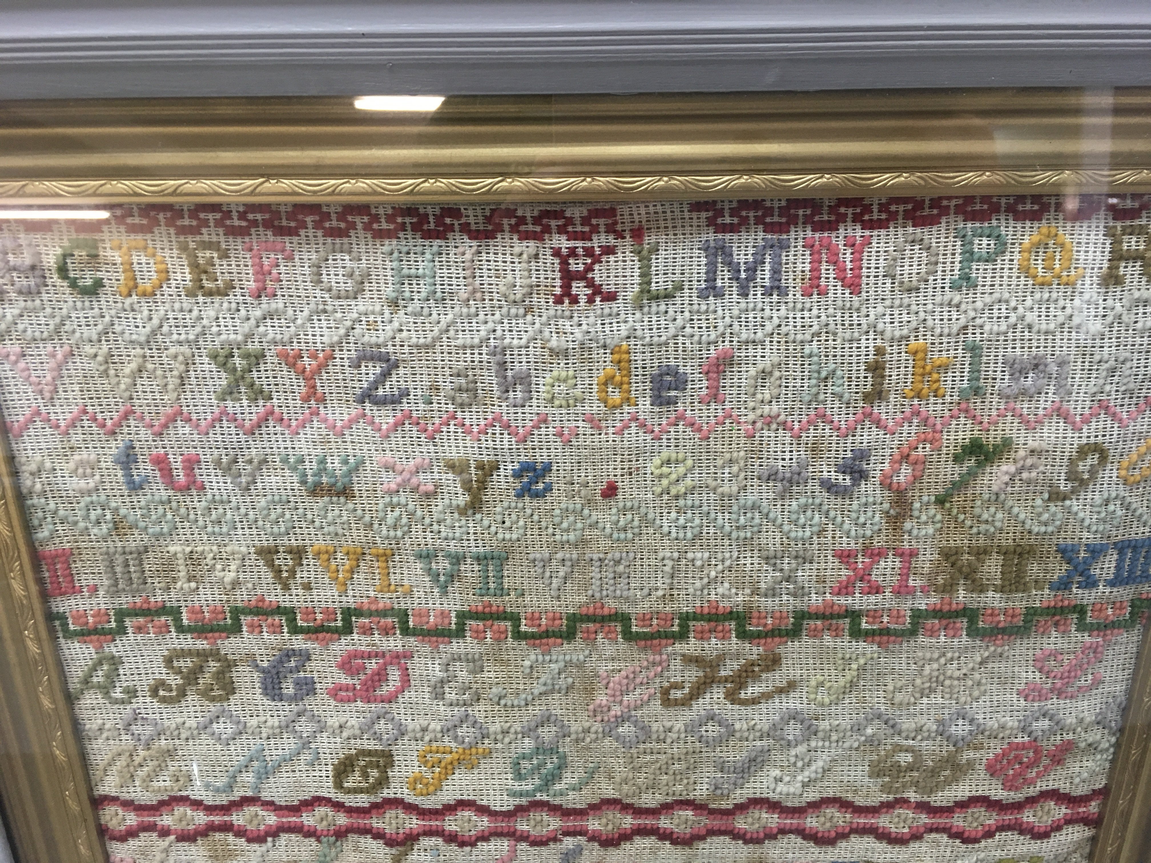 A Victorian needlework sampler in frame.- NO RESERVE