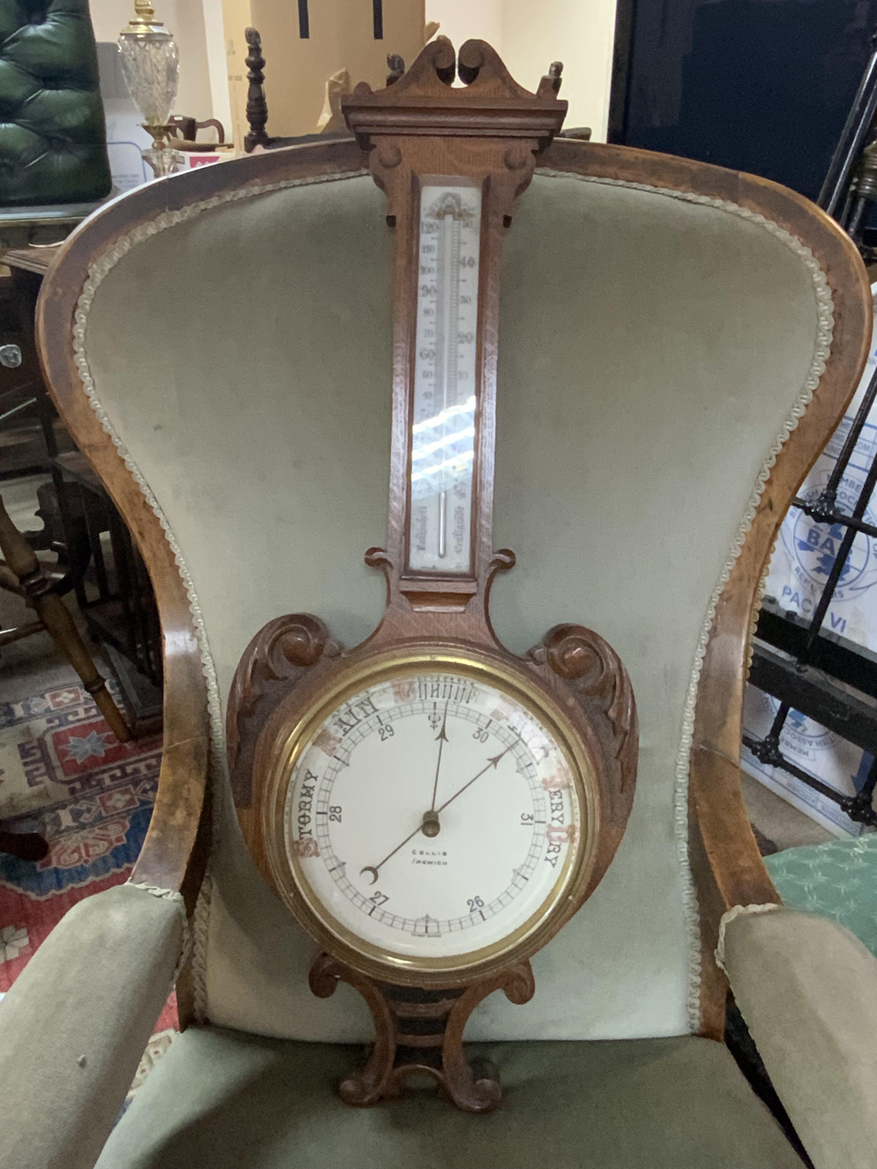 A Collins of Ipswich oak barometer. 74cm.