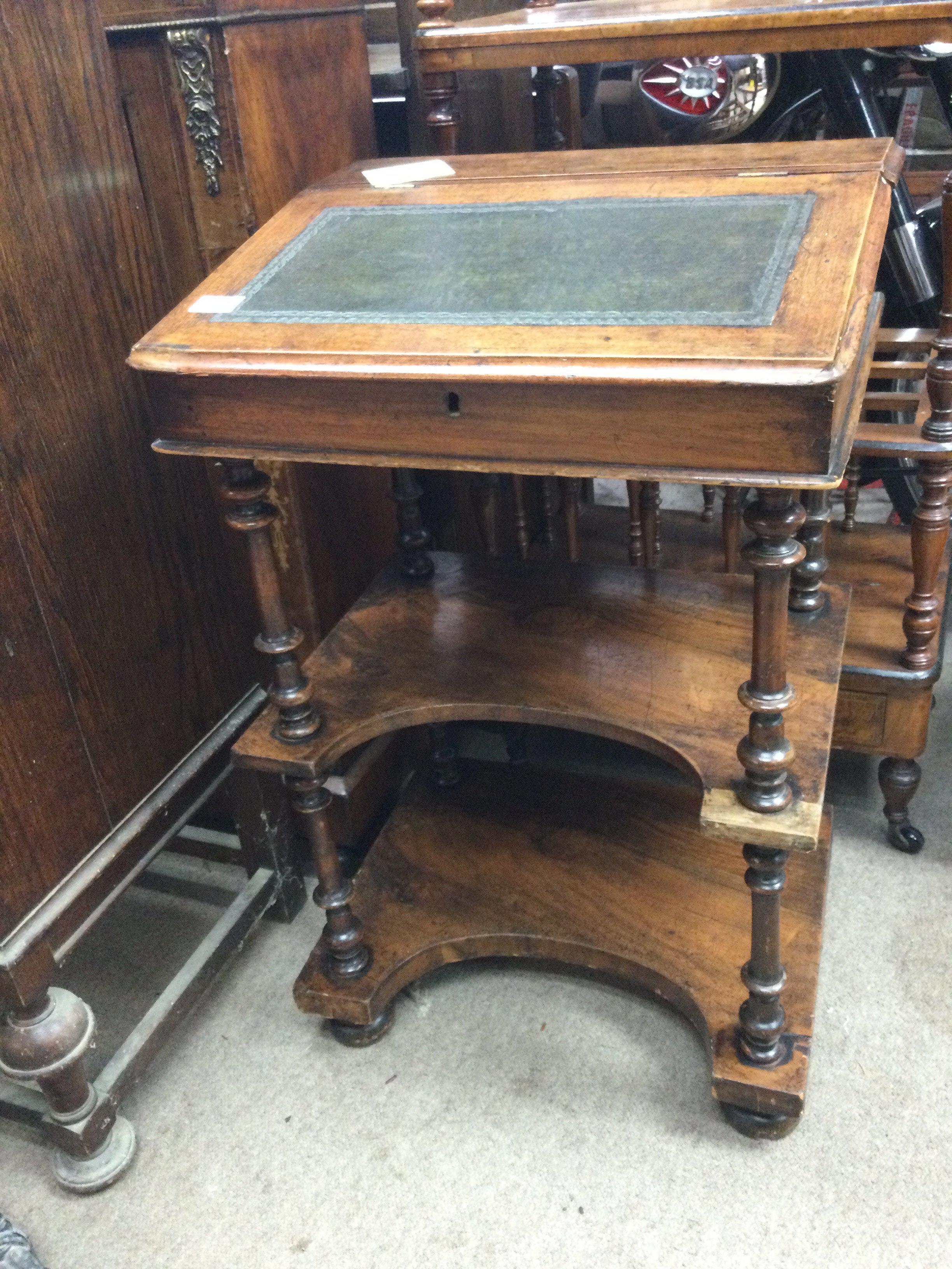 A Victorian mahogany Davenport&rsquo; the sloping front above pen sections