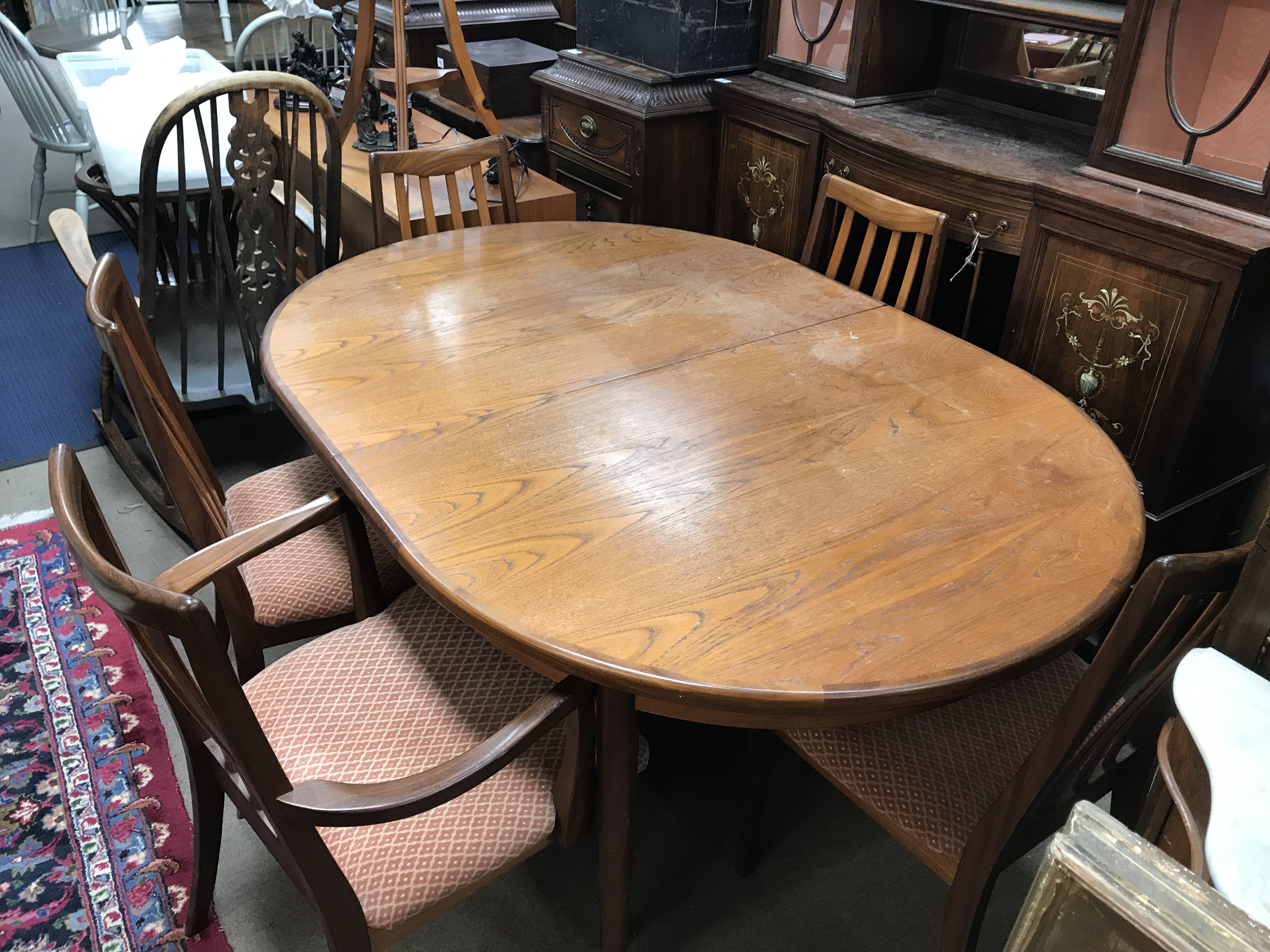 A G plan table and six chairs 162cm wide 72cm tall, 110cm long.