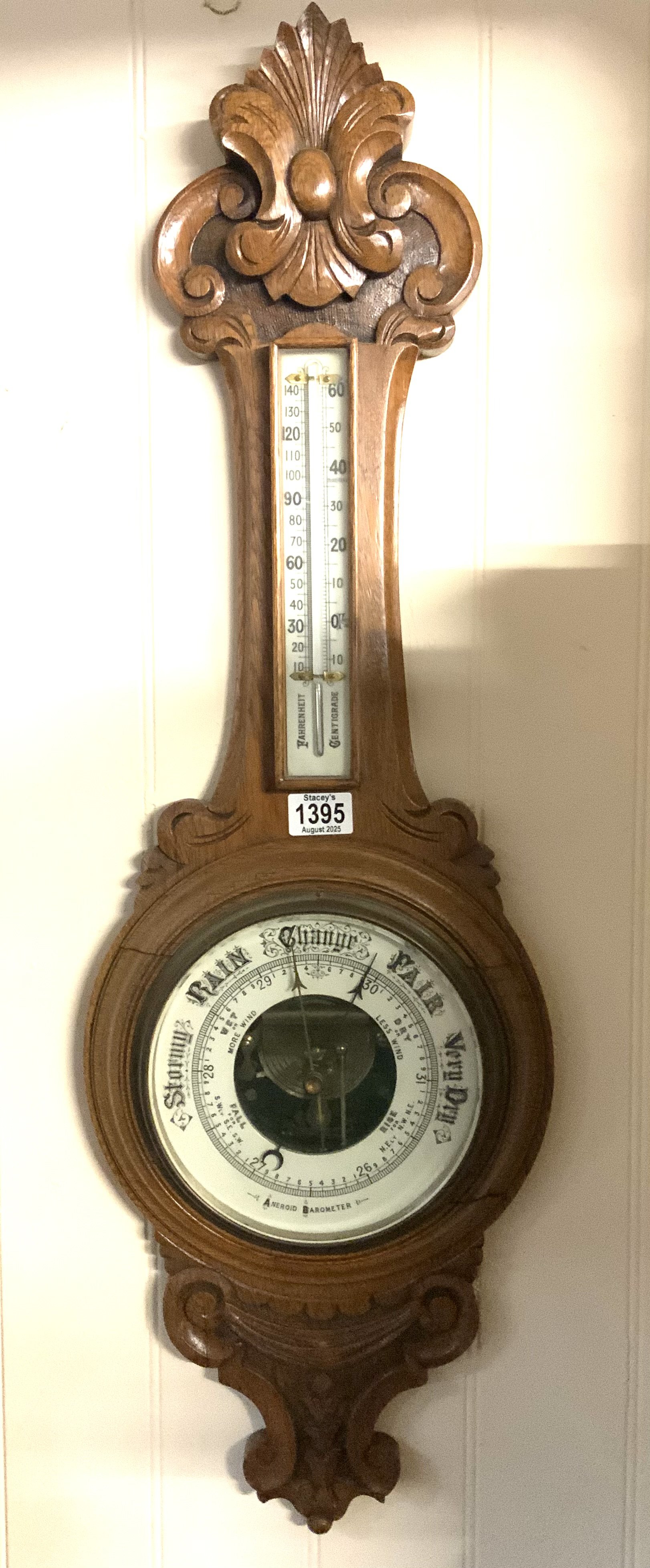 A carved oak framed barometer. No reserve.