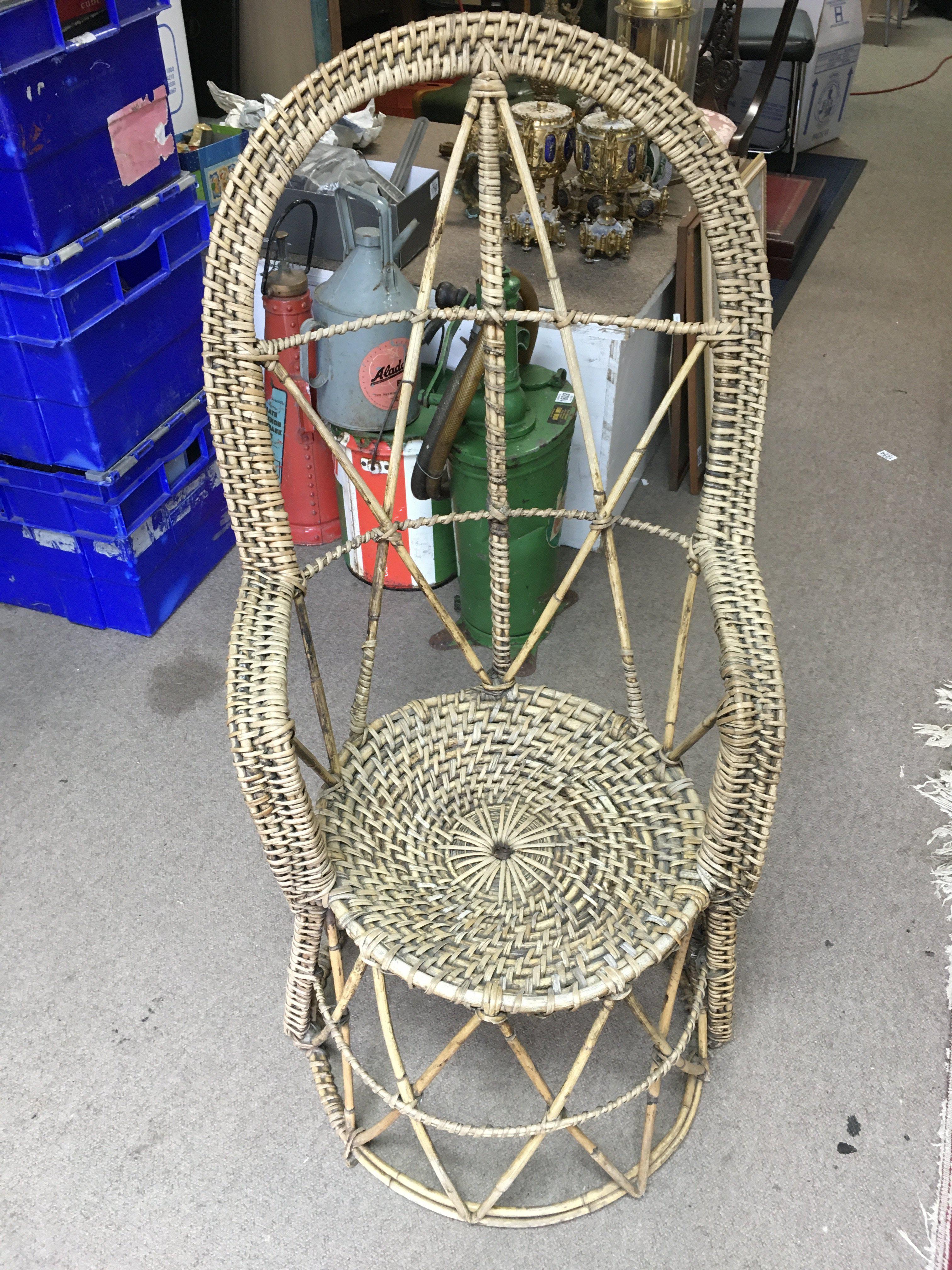 A vintage Rattan cane conservatory chair , dimensions 104cm tall 51cm wide- NO RESERVE