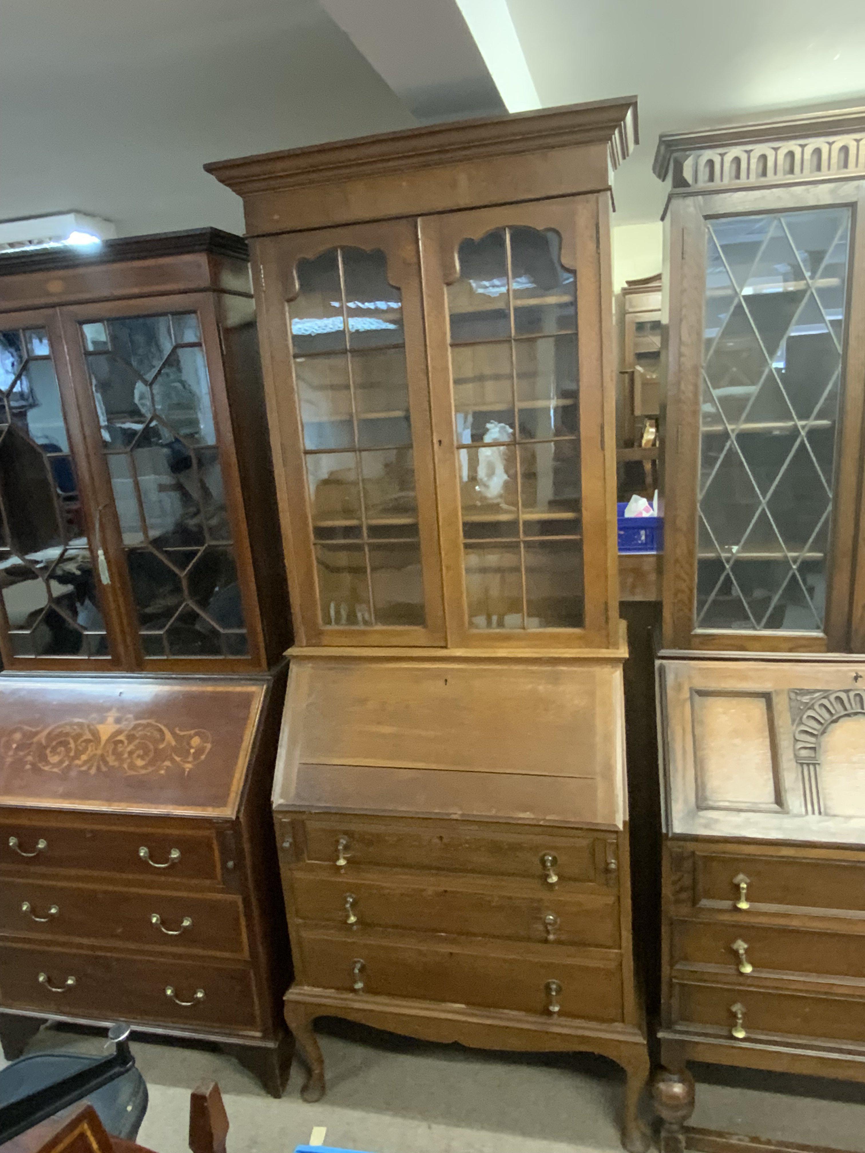 An oak bureau bookcase with glazed doors. 209cm x 84