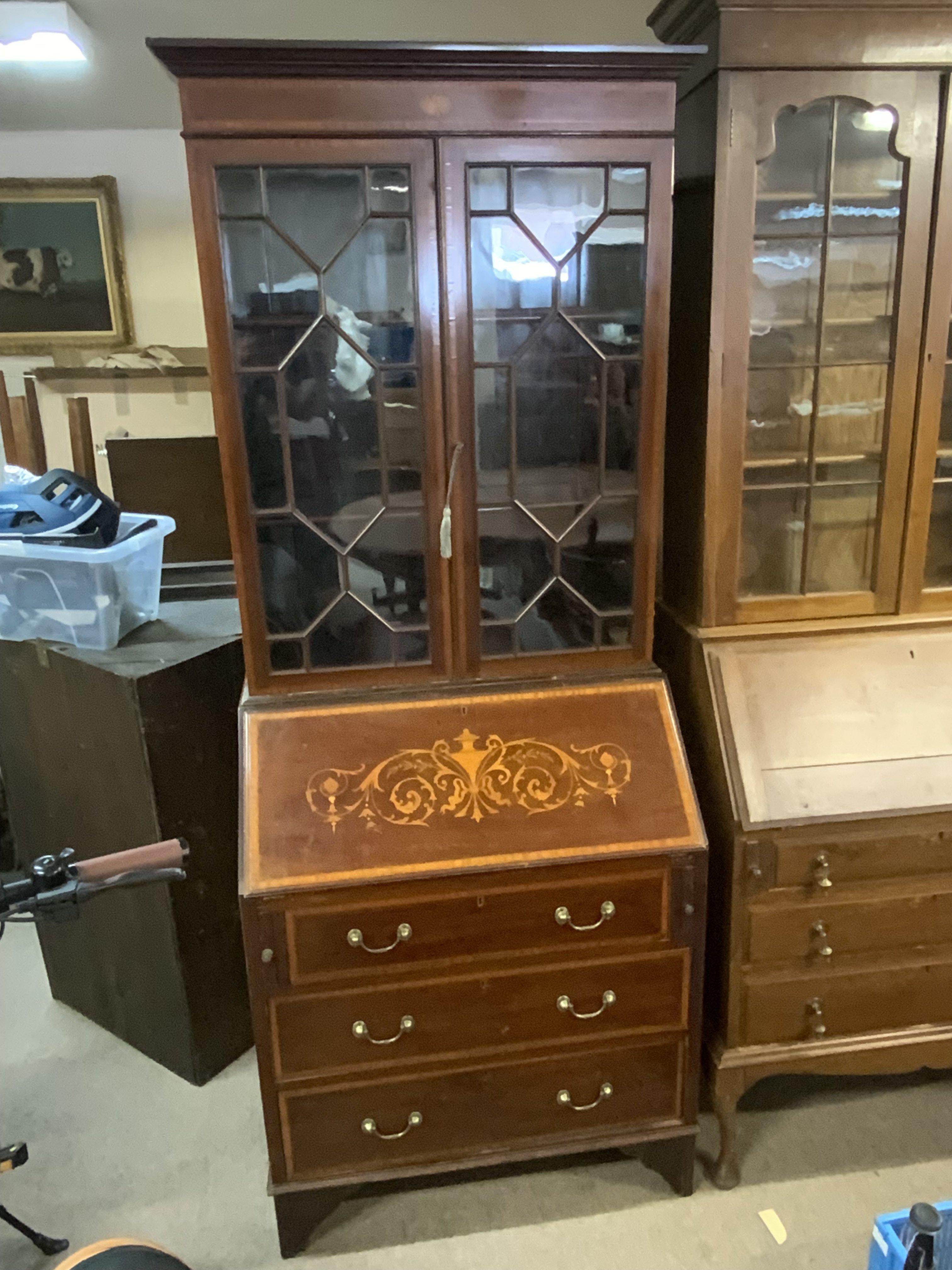 An Edwardian inlaid bureau bookcase. 197cm x 79cm.