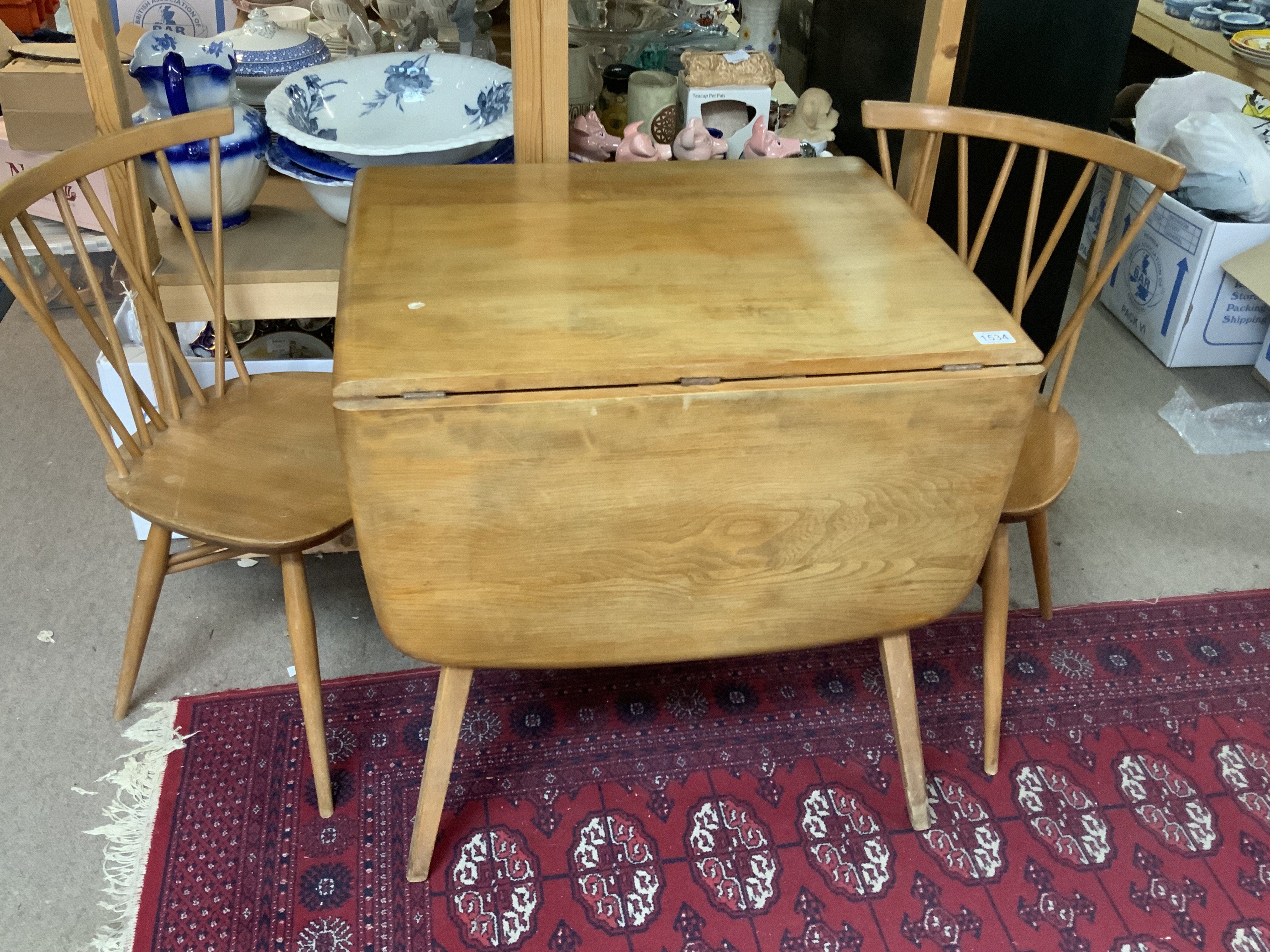Mid Century Blonde Ercol Windsor Plank Drop Leaf-Dining Table Together with a pair of Ercol Elm Chiltern candlestick dining chairs.