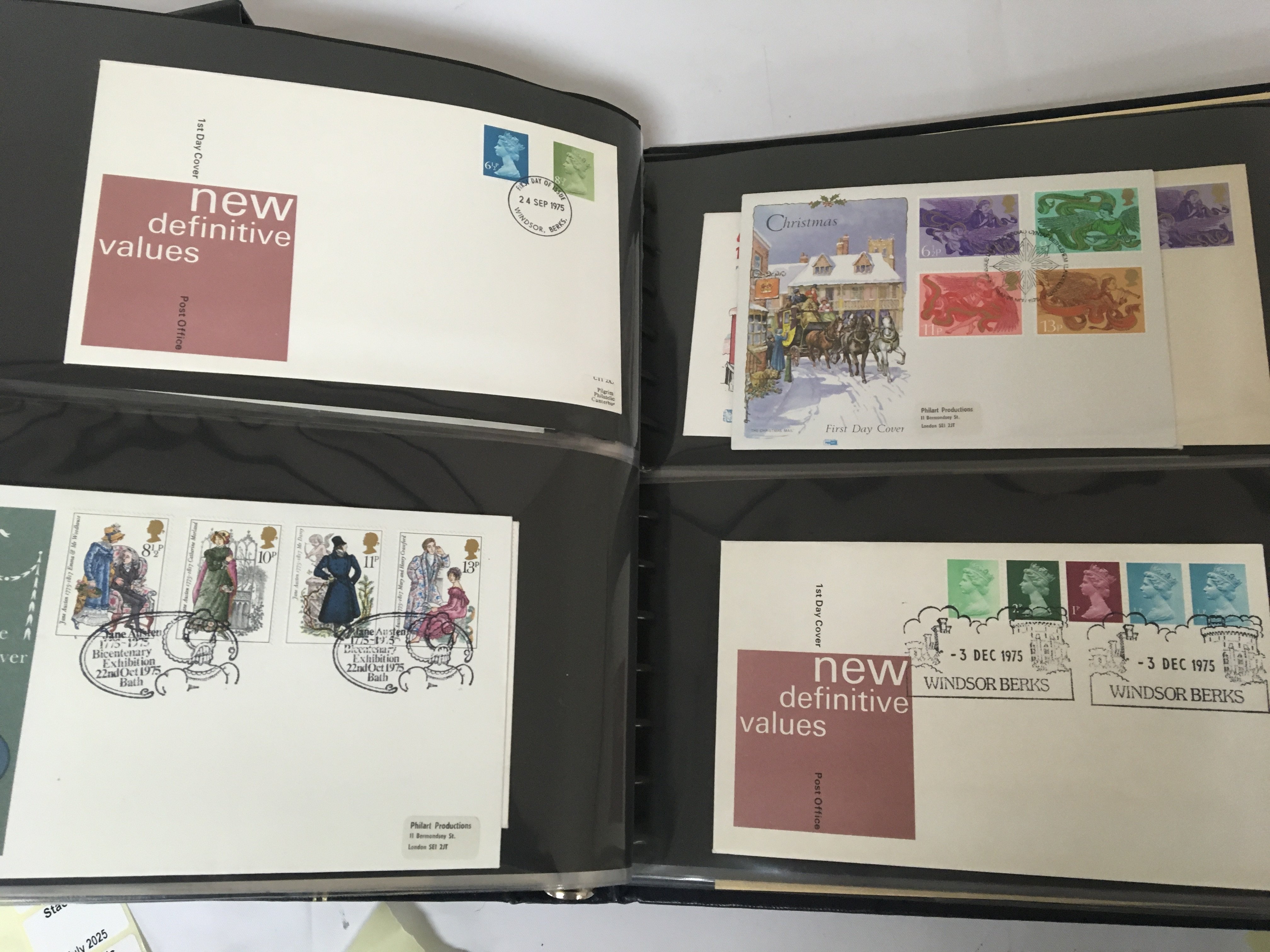 A box containing a collection of well presented first day covers in albums including Channel Islands.- NO RESERVE