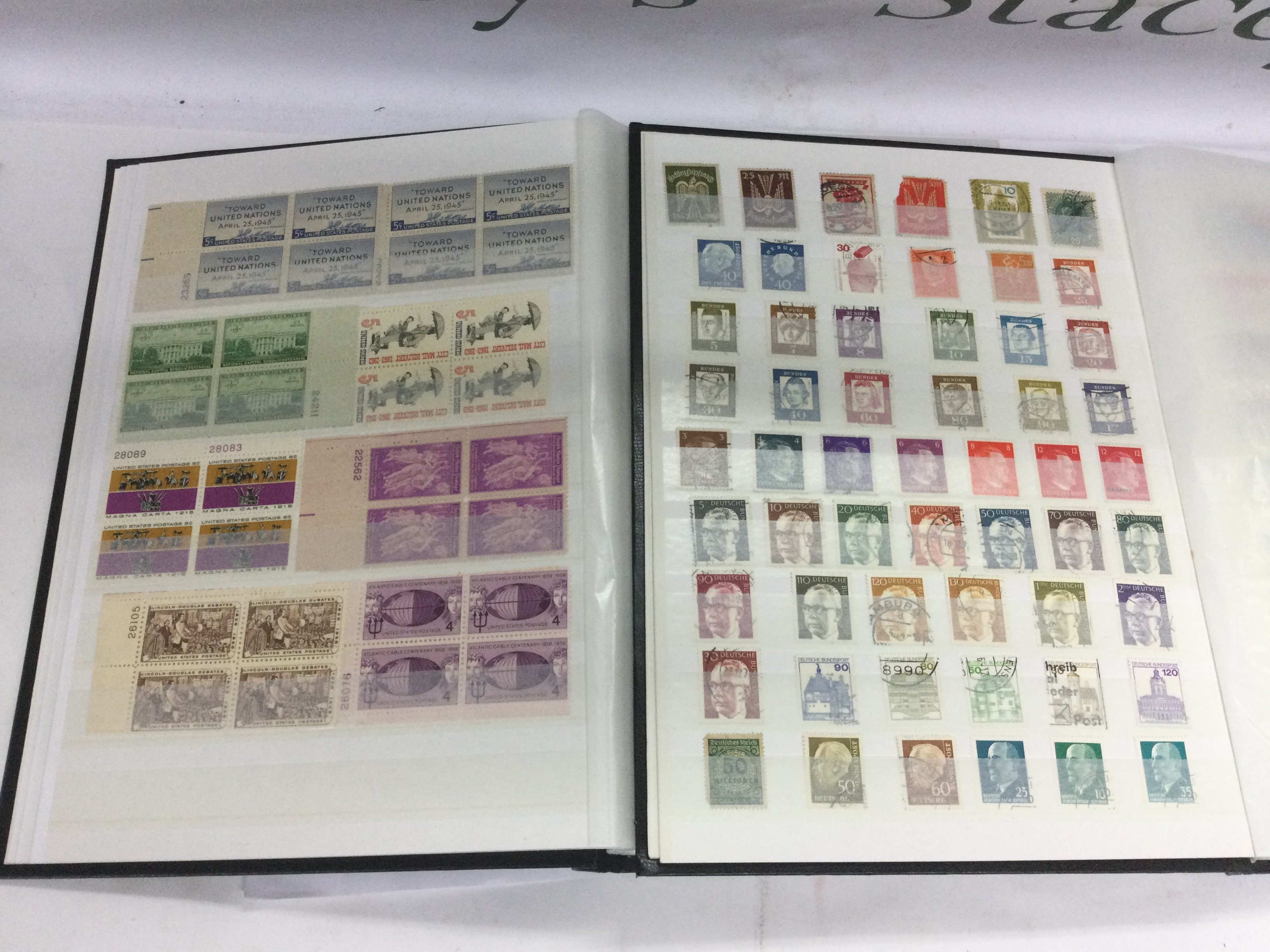 Two boxes of mixed world stamps and first day covers. Shipping category D.