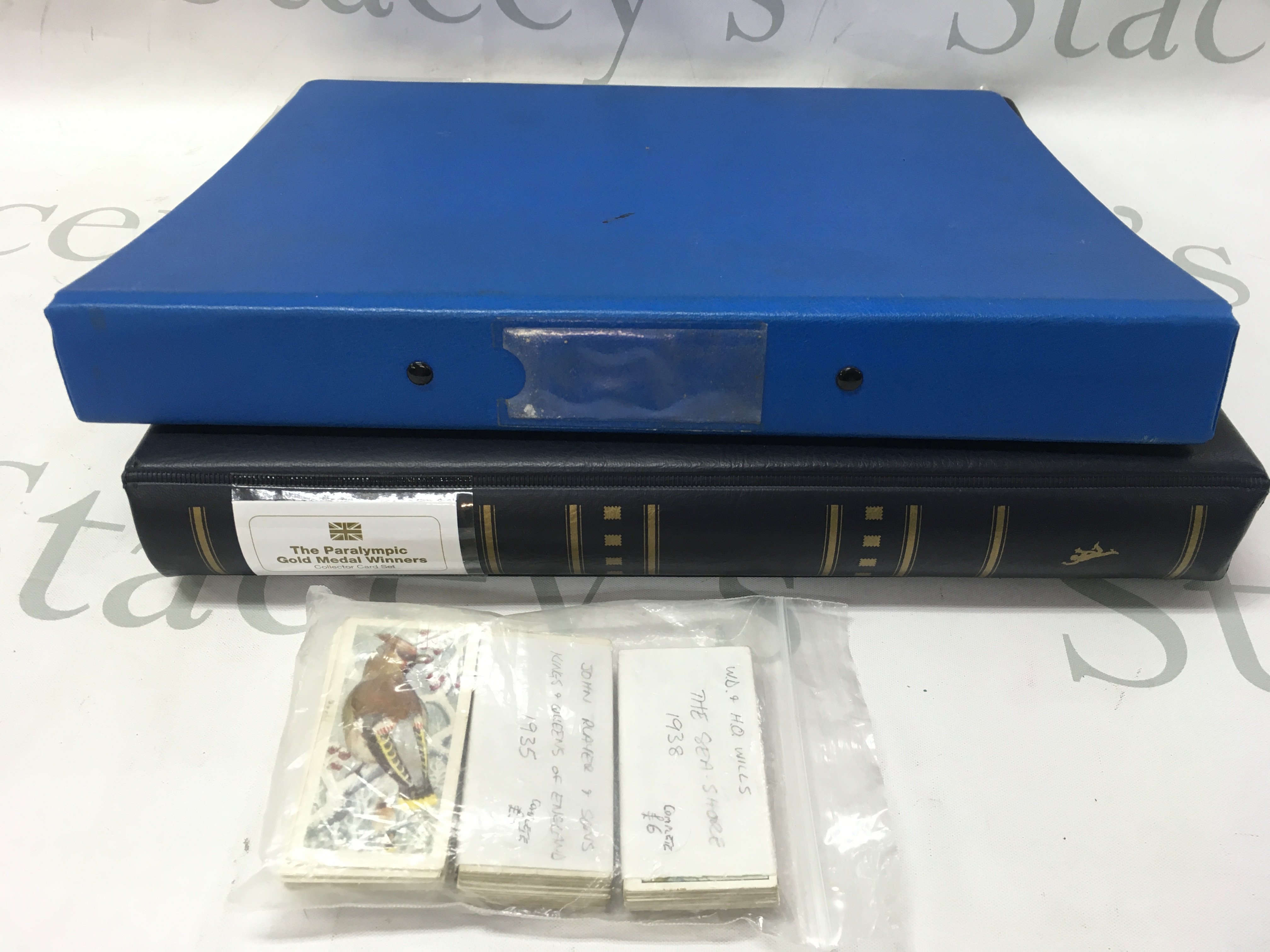 A collection of cigarette cards including Wills , Players and first day cover Paralympics collectors cards. Postage category b