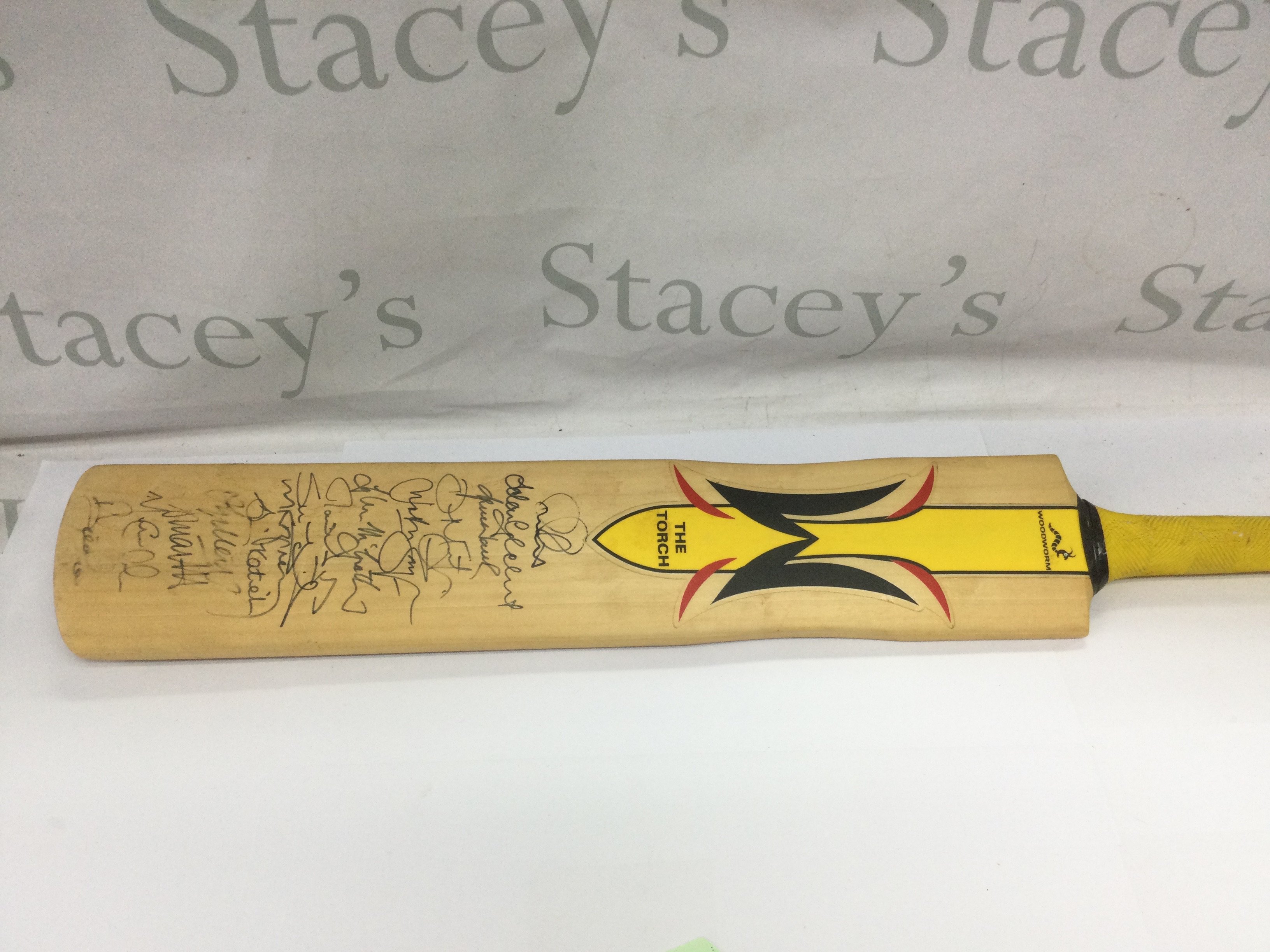 A signed cricket bat. Shipping category C.