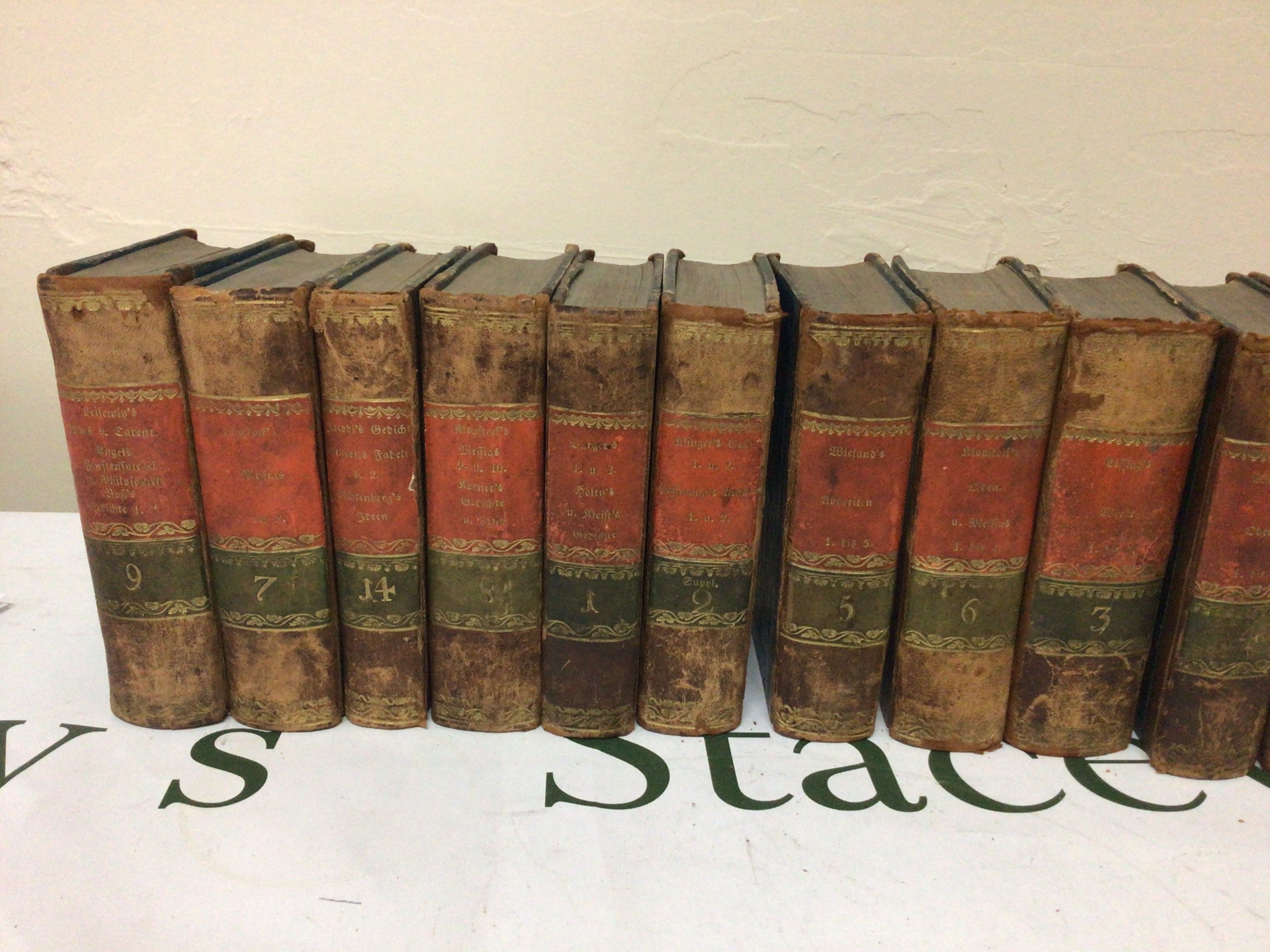 A collection of half leather books 1829 and others.