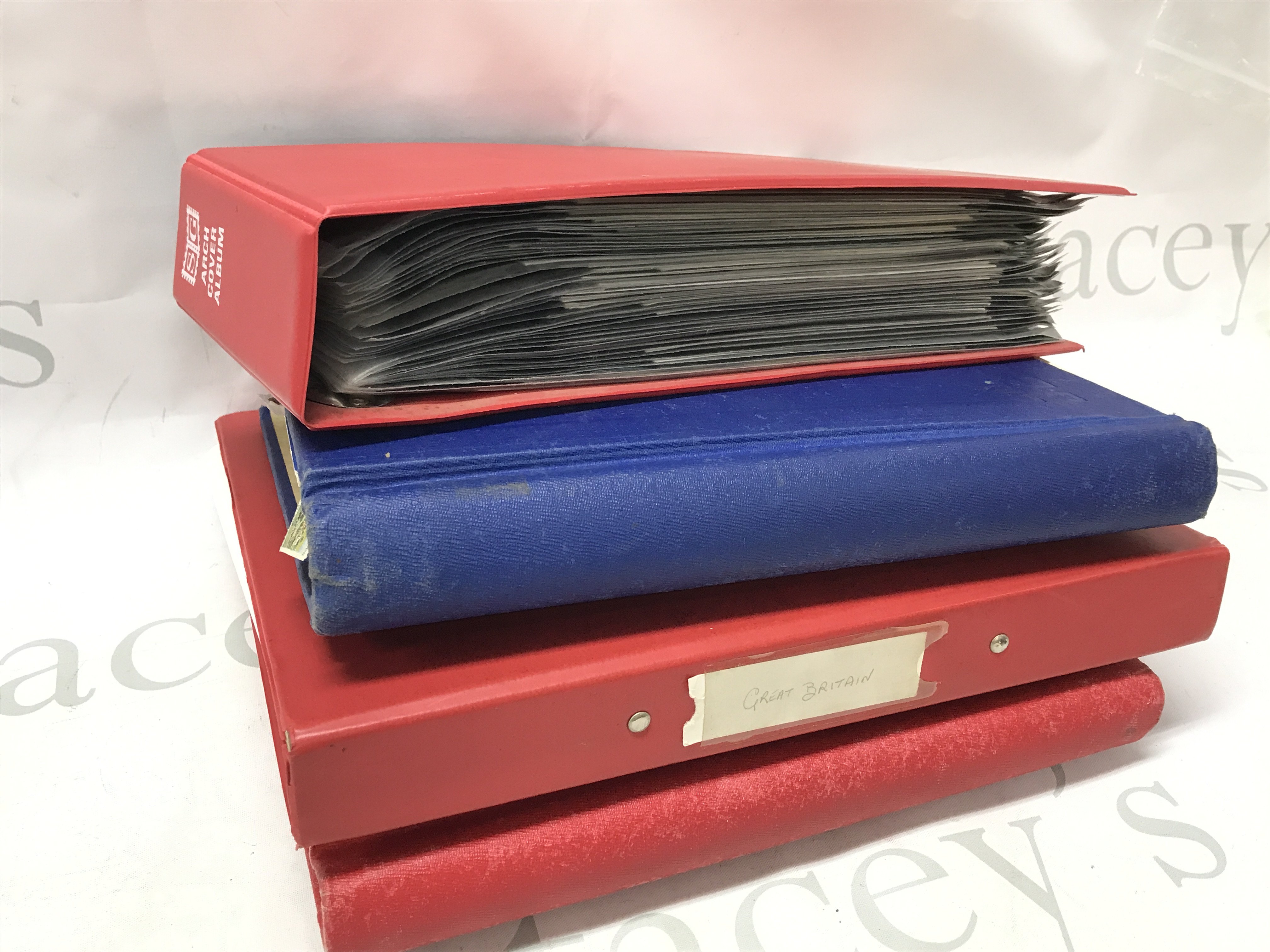 Stamp albums including 20th century British unused and used stamps, world stamps including Portuguese Colonies, Rhodesia, Russian , Swiss, Ukrainian , Palestine, Polish etc and a first day cover album , some loose stamps