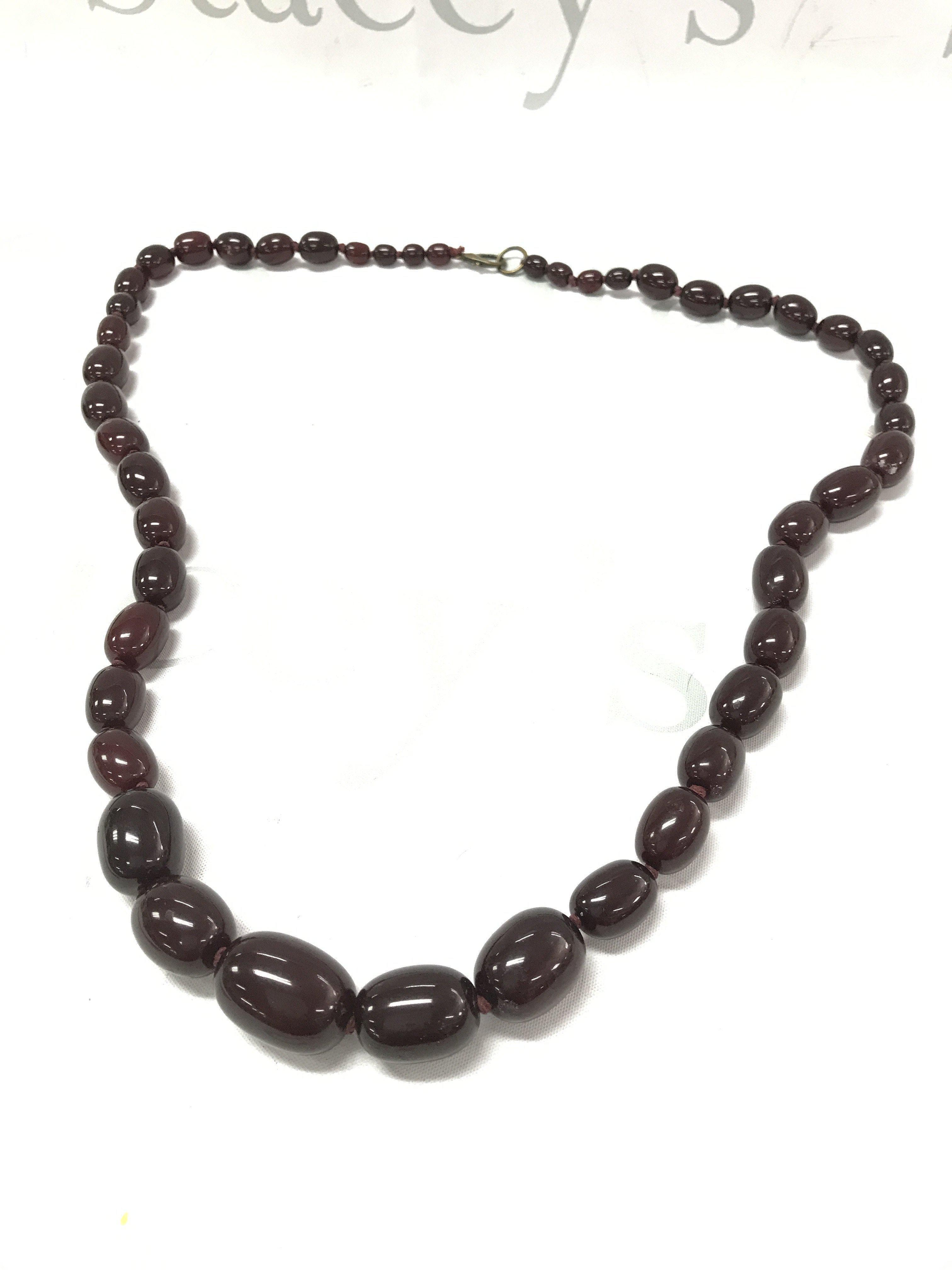 Cherry red coloured amber style necklace ,130g 91cm . Postage category A