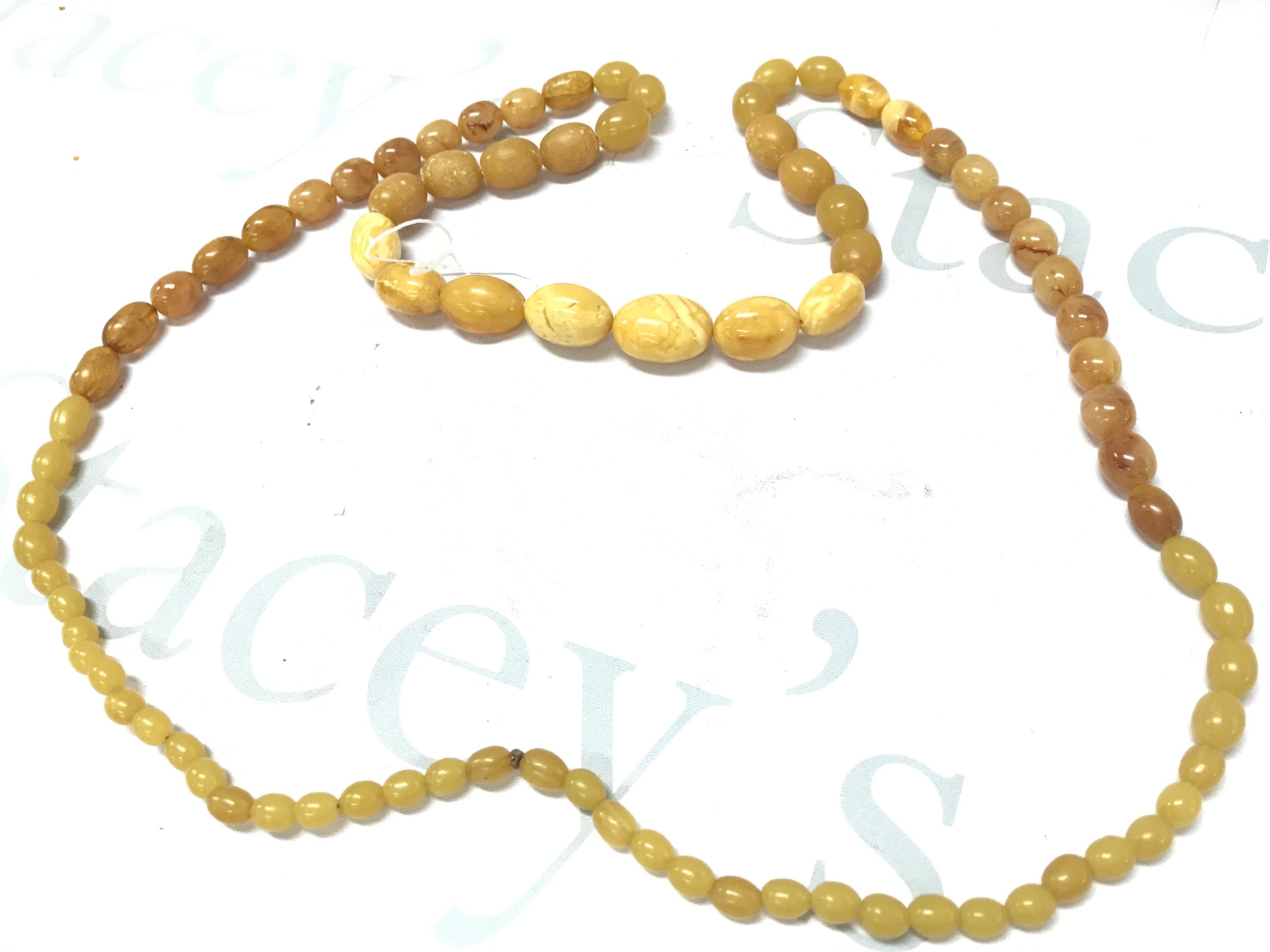 A very large butterscotch mixed colours amber necklace , 105g 120cm