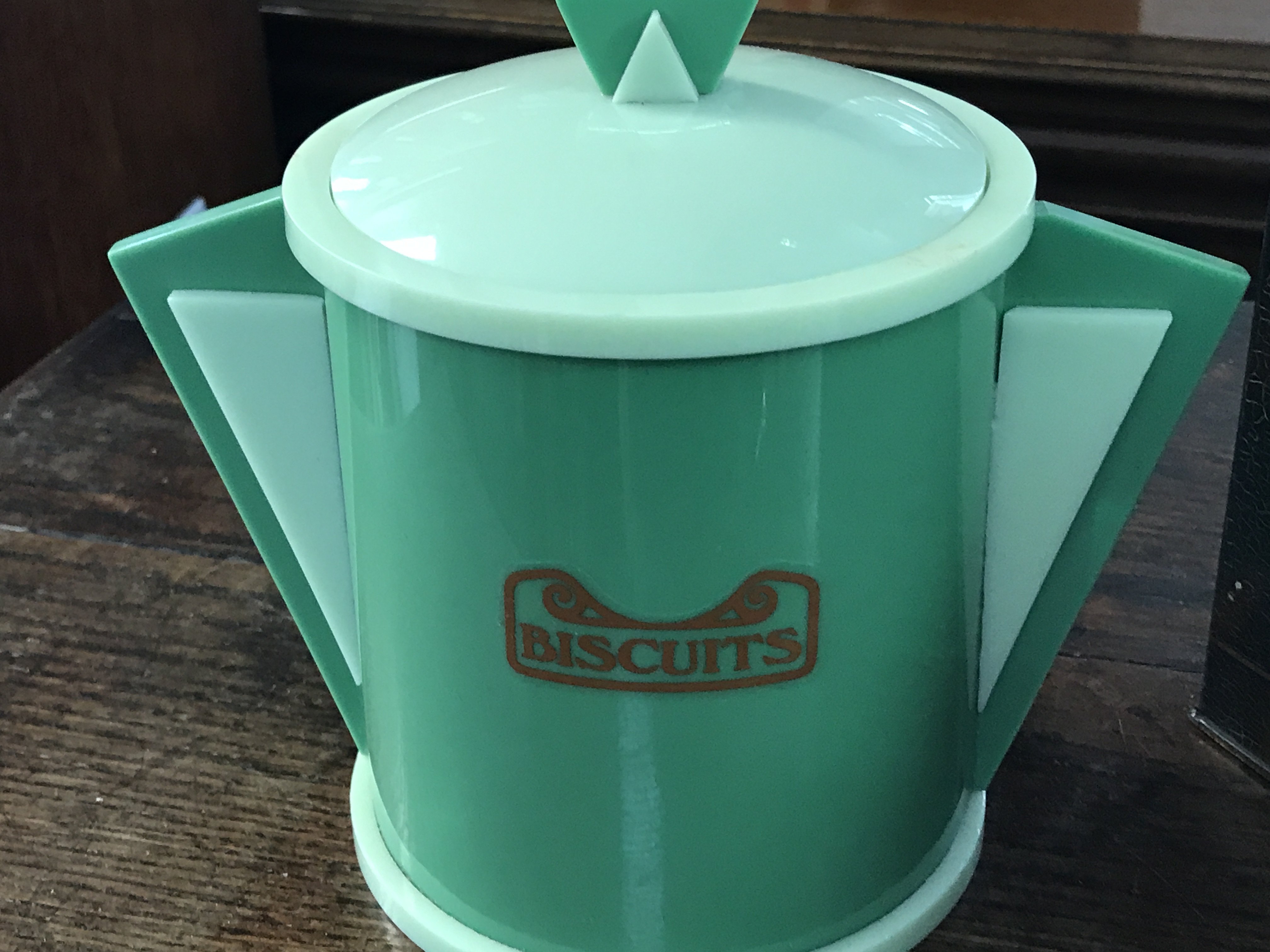 A blue bird tin and an art deco plastic jar. Postage category C- NO RESERVE