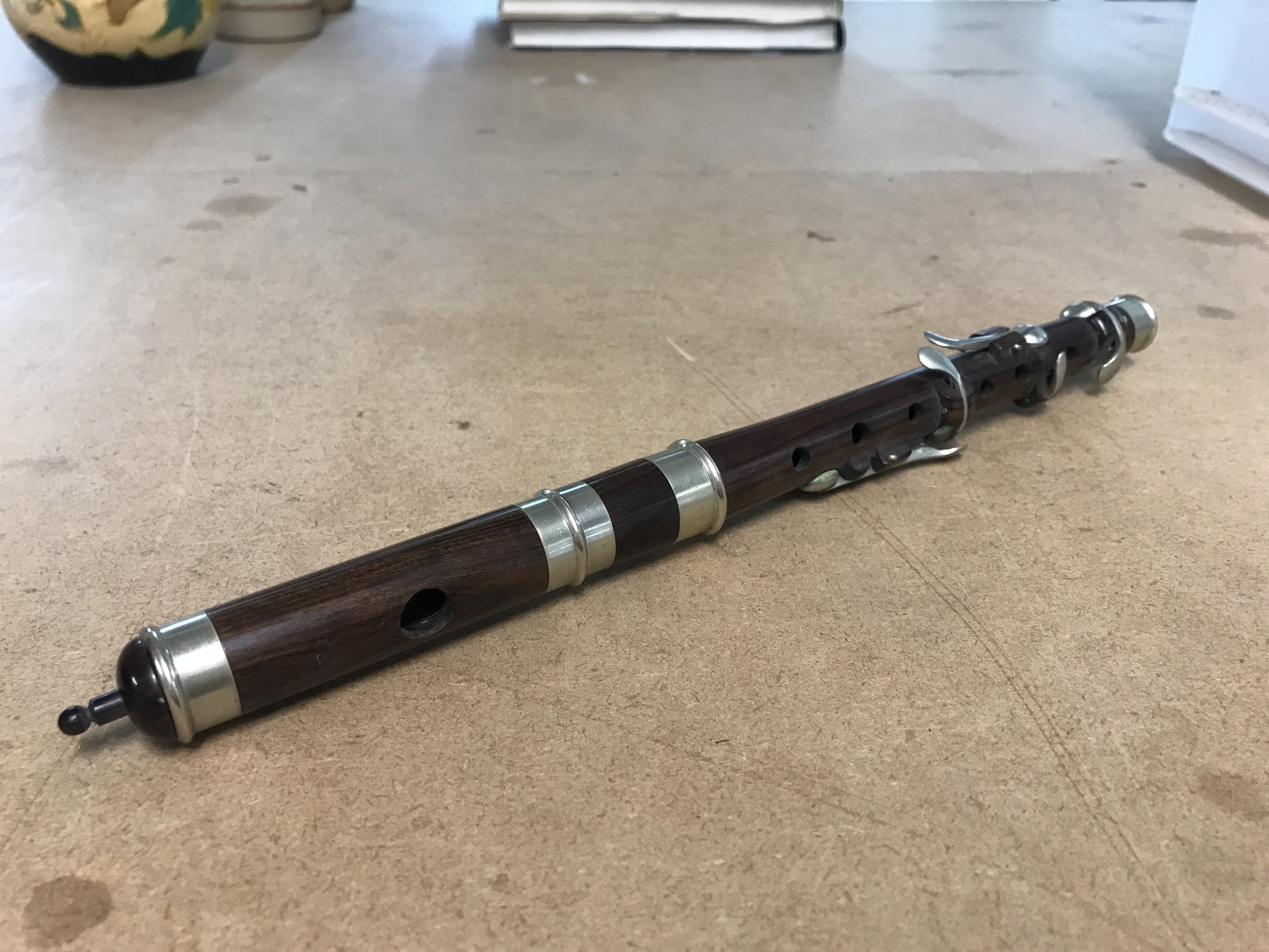 A cased rosewood flute , postage category B
