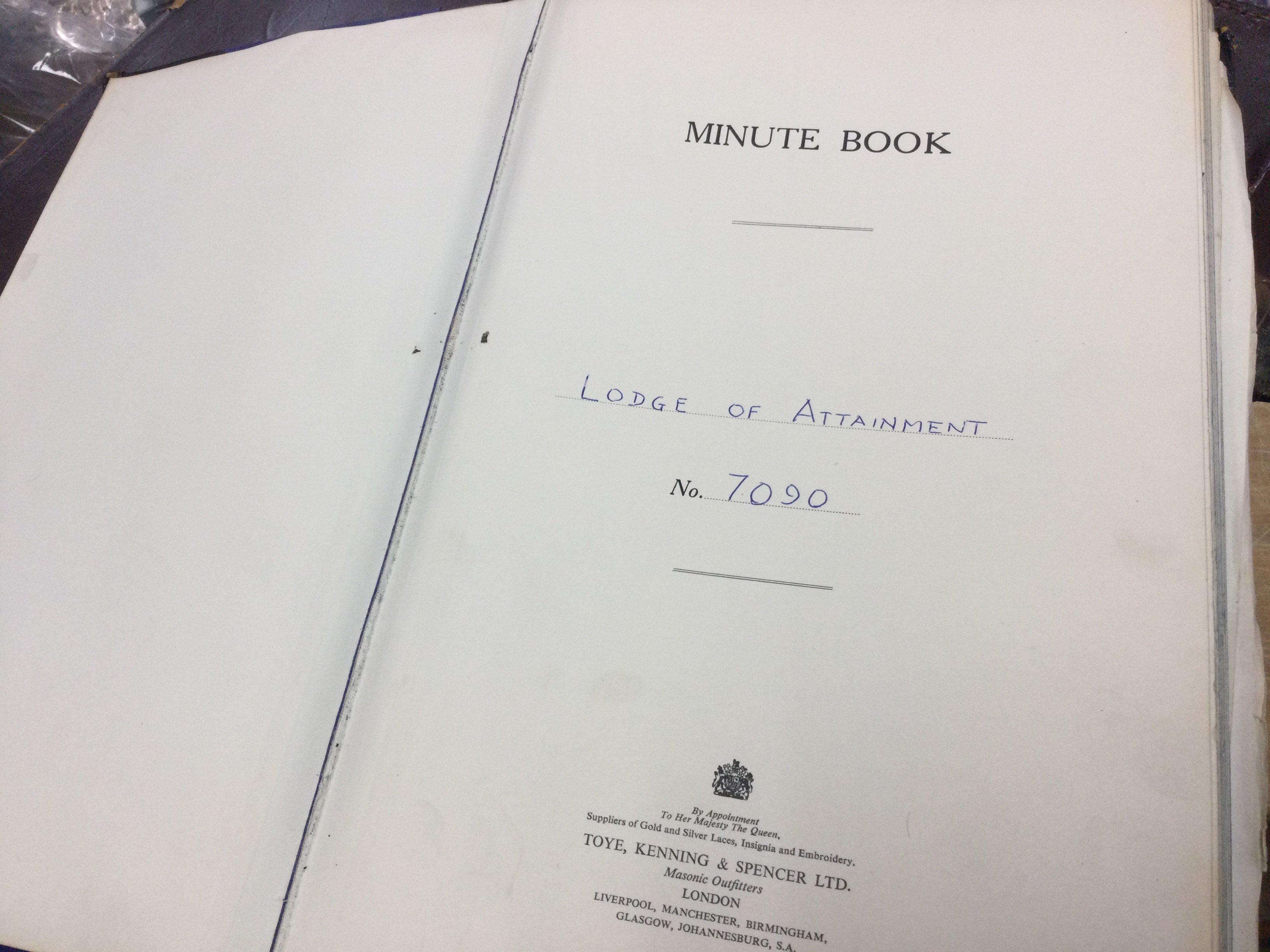 A leather case containing Masonic items including a Minute book. This lot cannot be posted