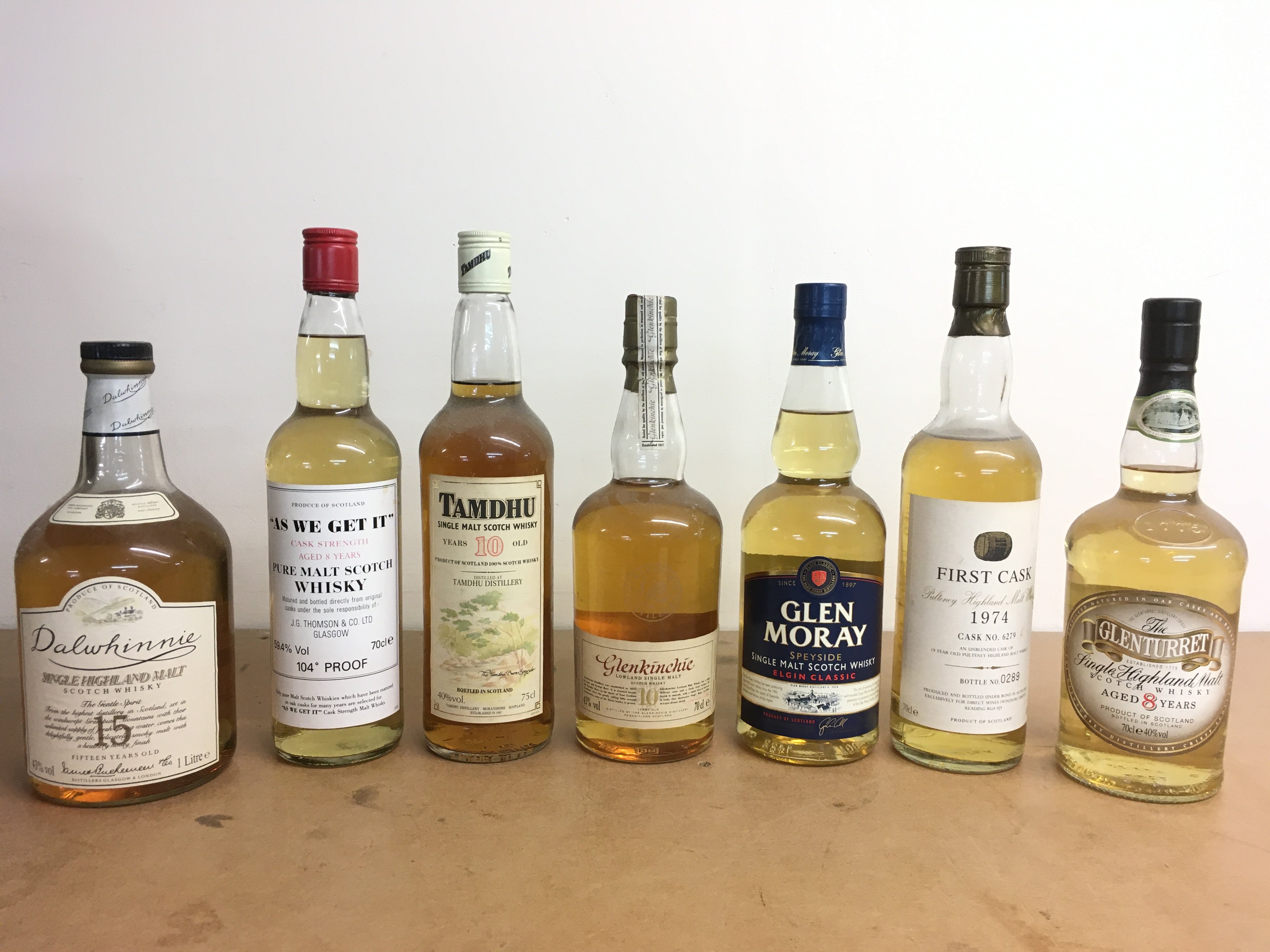 A collection of whiskey including Dalwhinnie single highland malt scotch 15 year old , As we get it 8 years pure malt scotch J.G Thomson, Tamdhu 10 years single malt scotch , Glenkenchie single malt 10 year, Glen Moray, First Cask 1974 19 year old , Glenturret 8 year old scotch . This lot cannot be posted