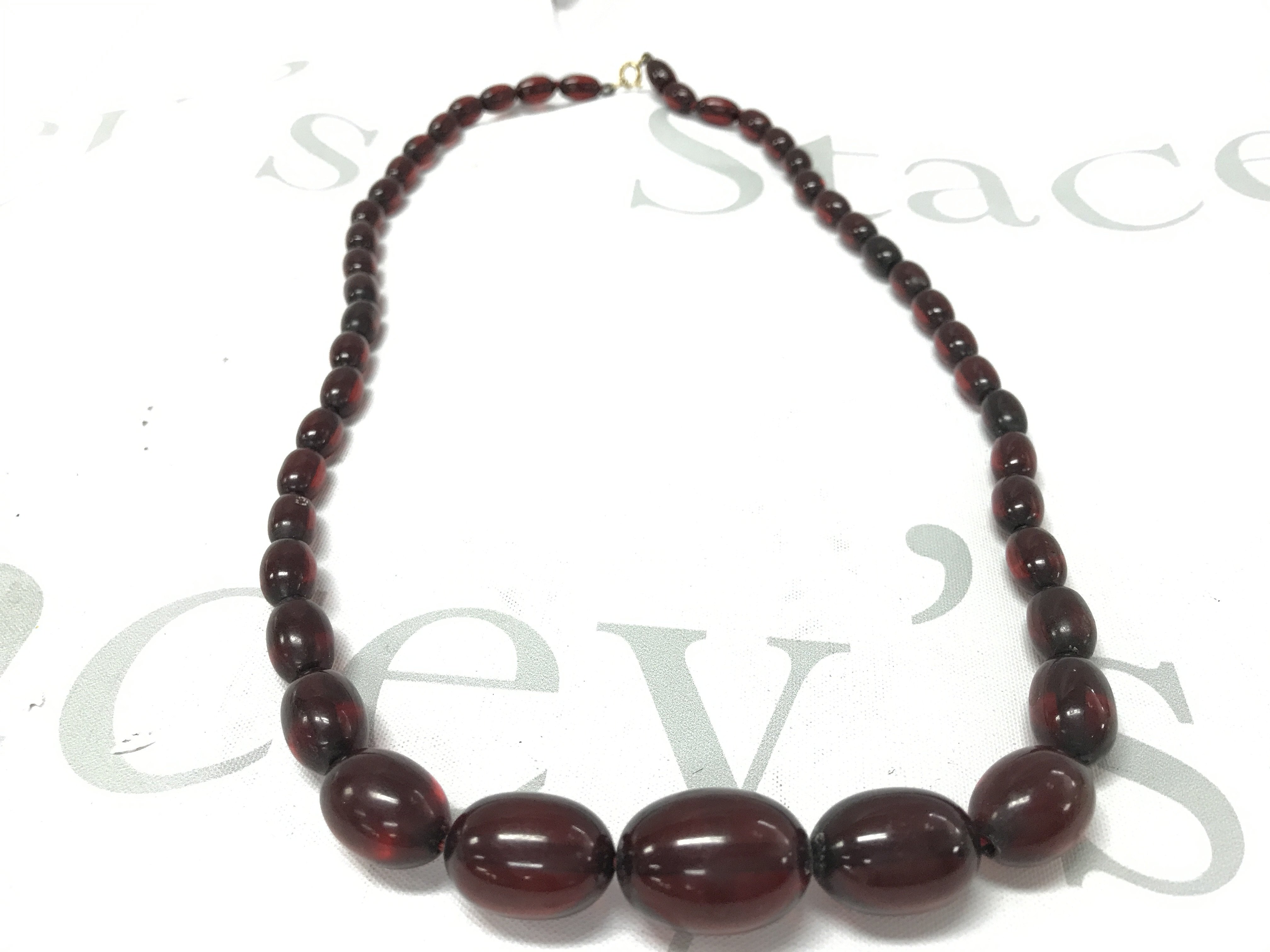Cherry amber coloured Bakelite style necklace , 45g 65cm. Postage category A