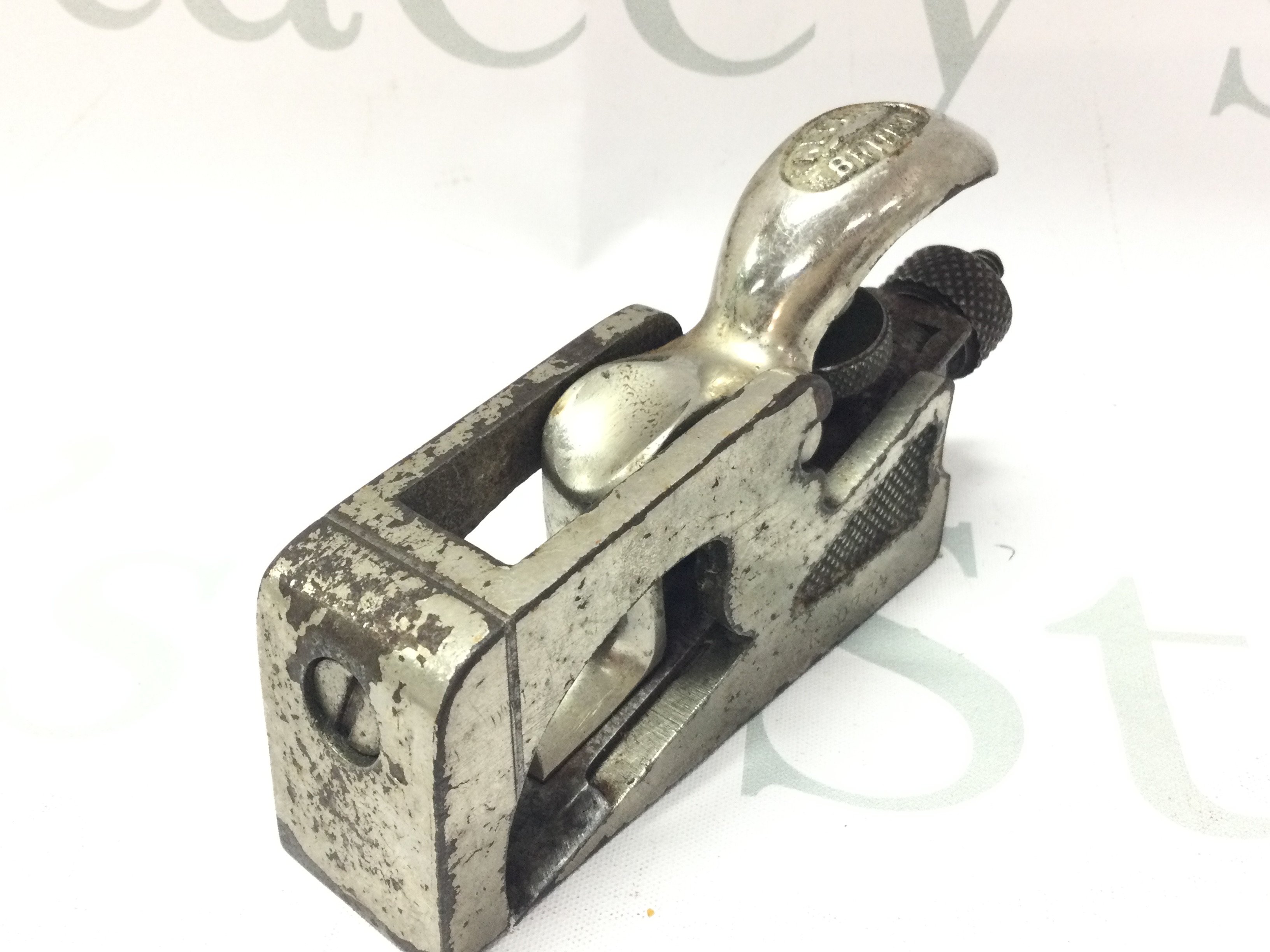 A small vintage record silver plated wood plane . Postage category a