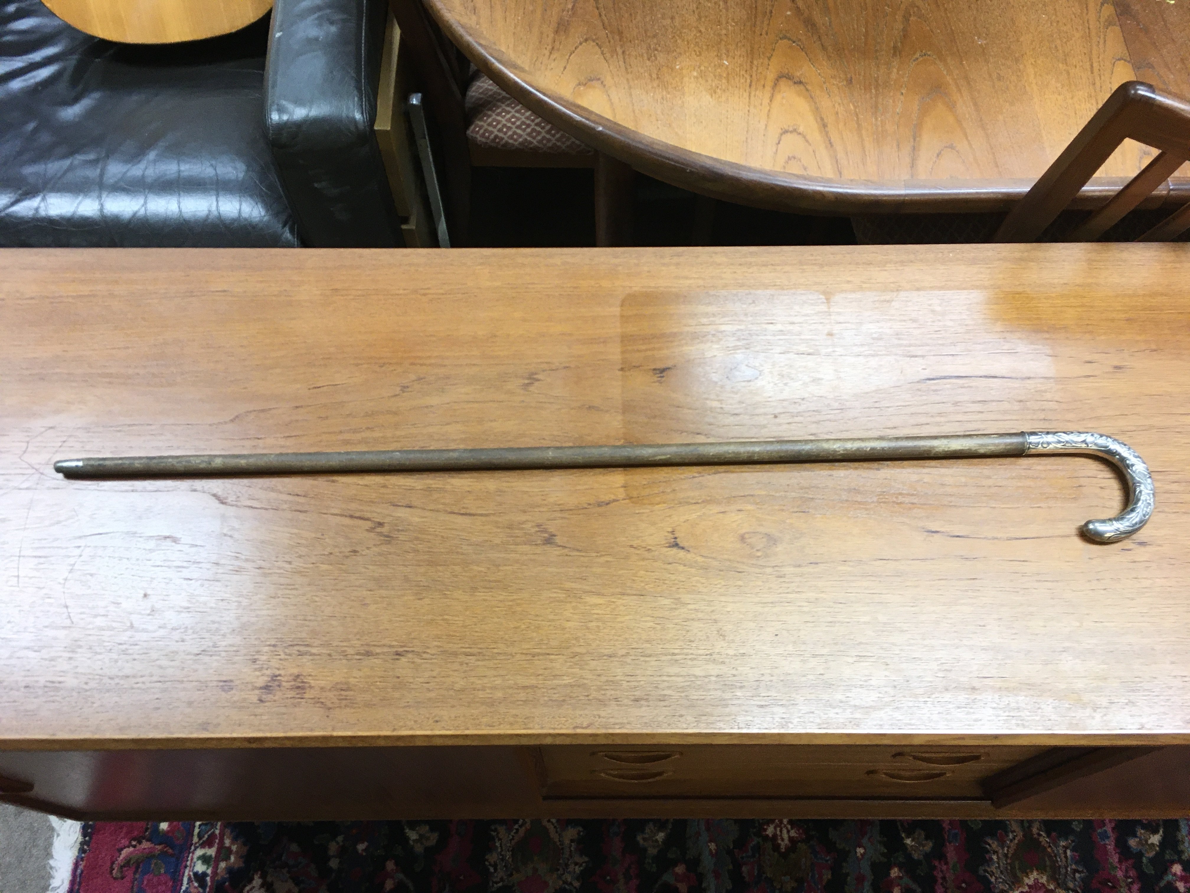 A walking stick with a silver Art Nouveau design handle , 800 marked. 90cm long.