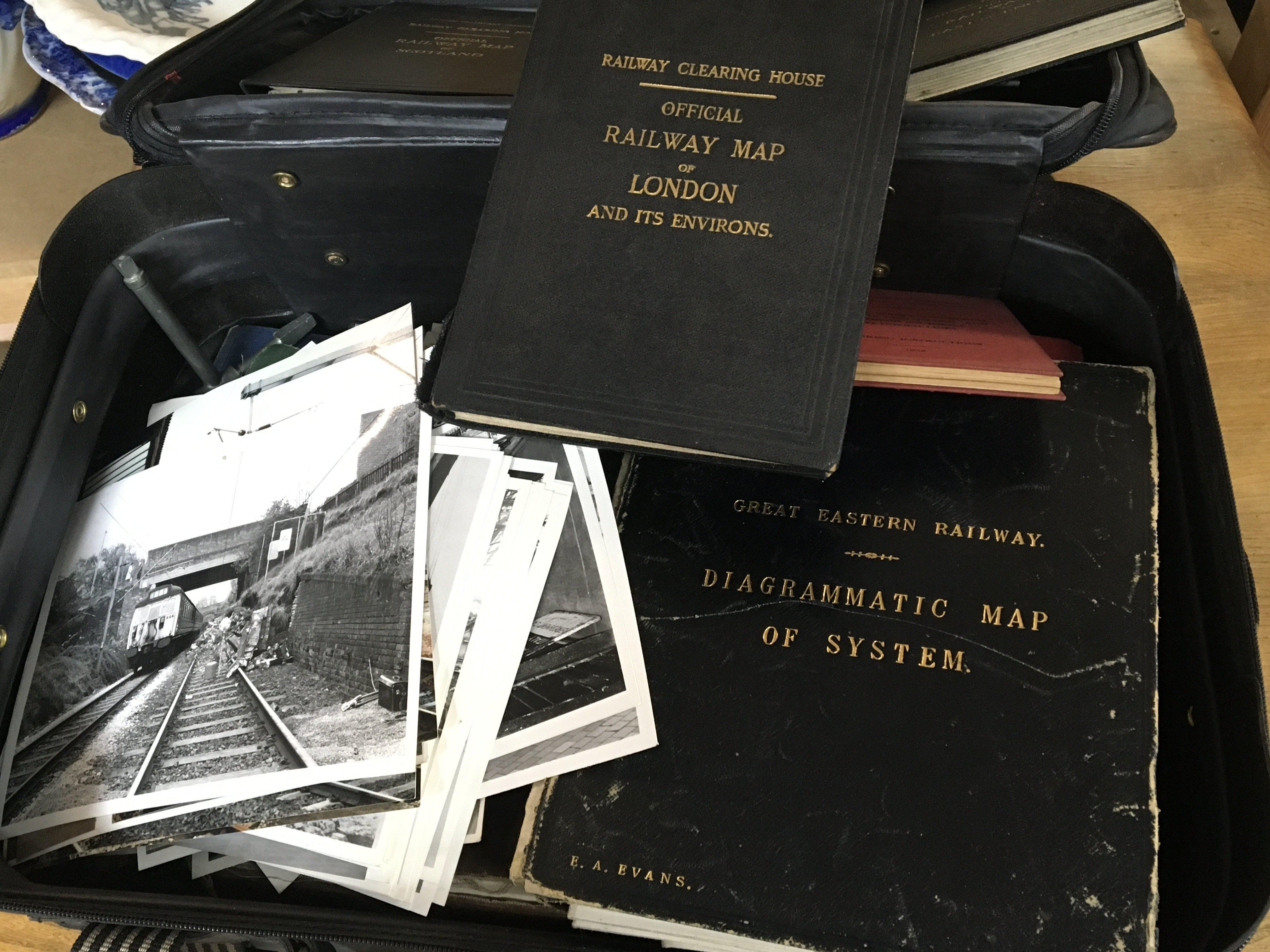 A case containing British Rail and British train memorabilia including Press photos a Vintage folding information diagram Great Eastern Railways Railway Clearing House Railway maps London East of England Scotland and many other related ephemera.