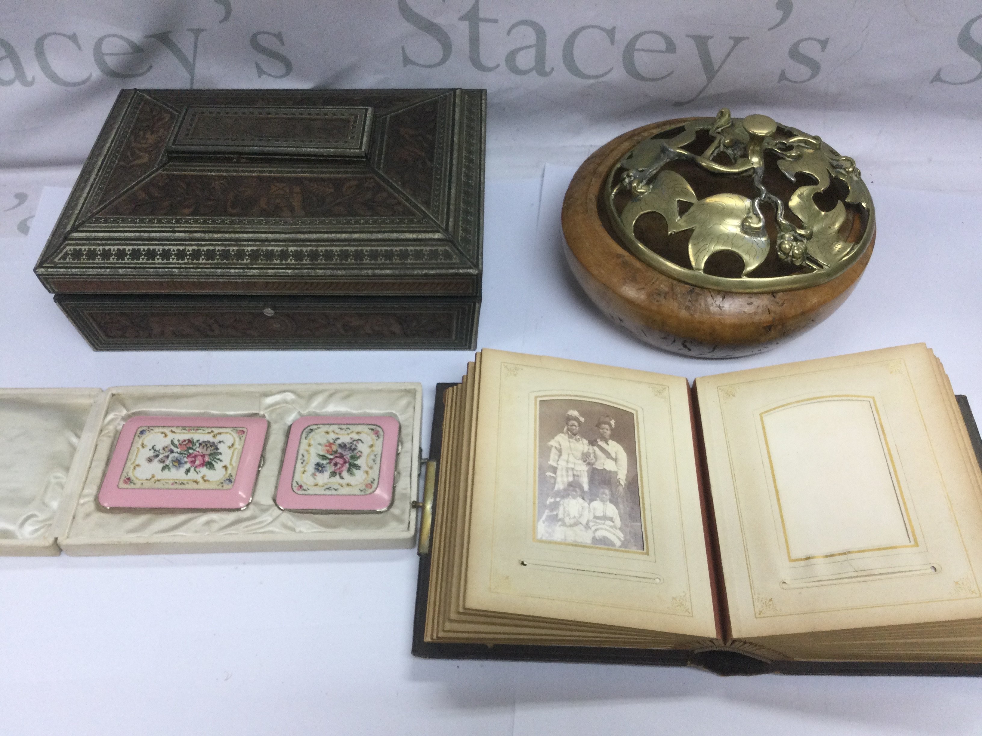 A leather bound photo album, enamel compacts etc. Shipping category D.