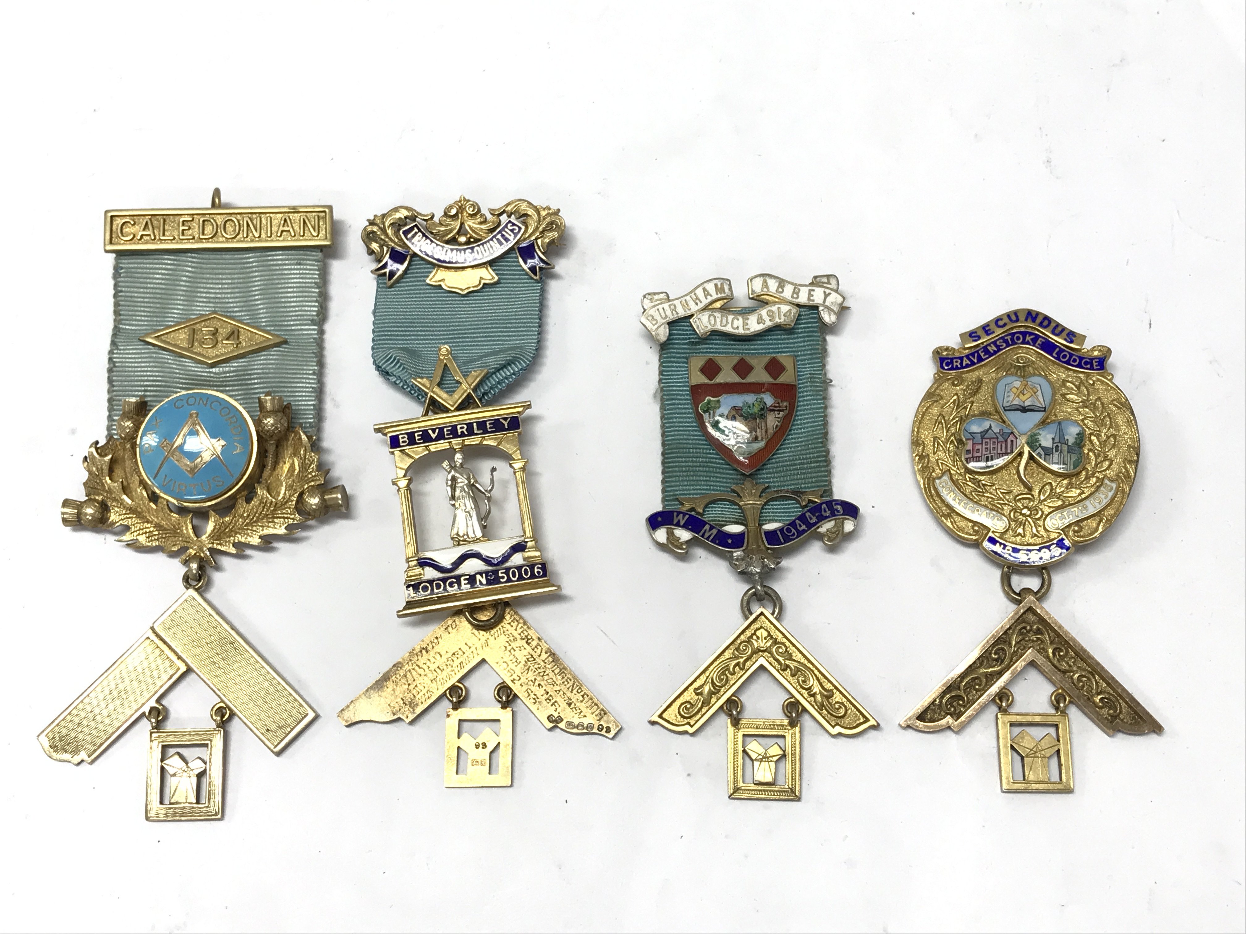 Four Masonic silver gilt jewels with elaborate enamel decoration, British lodges Beverley, Burnham Abbey, Gravenstoke, Caledonian. Postage category A