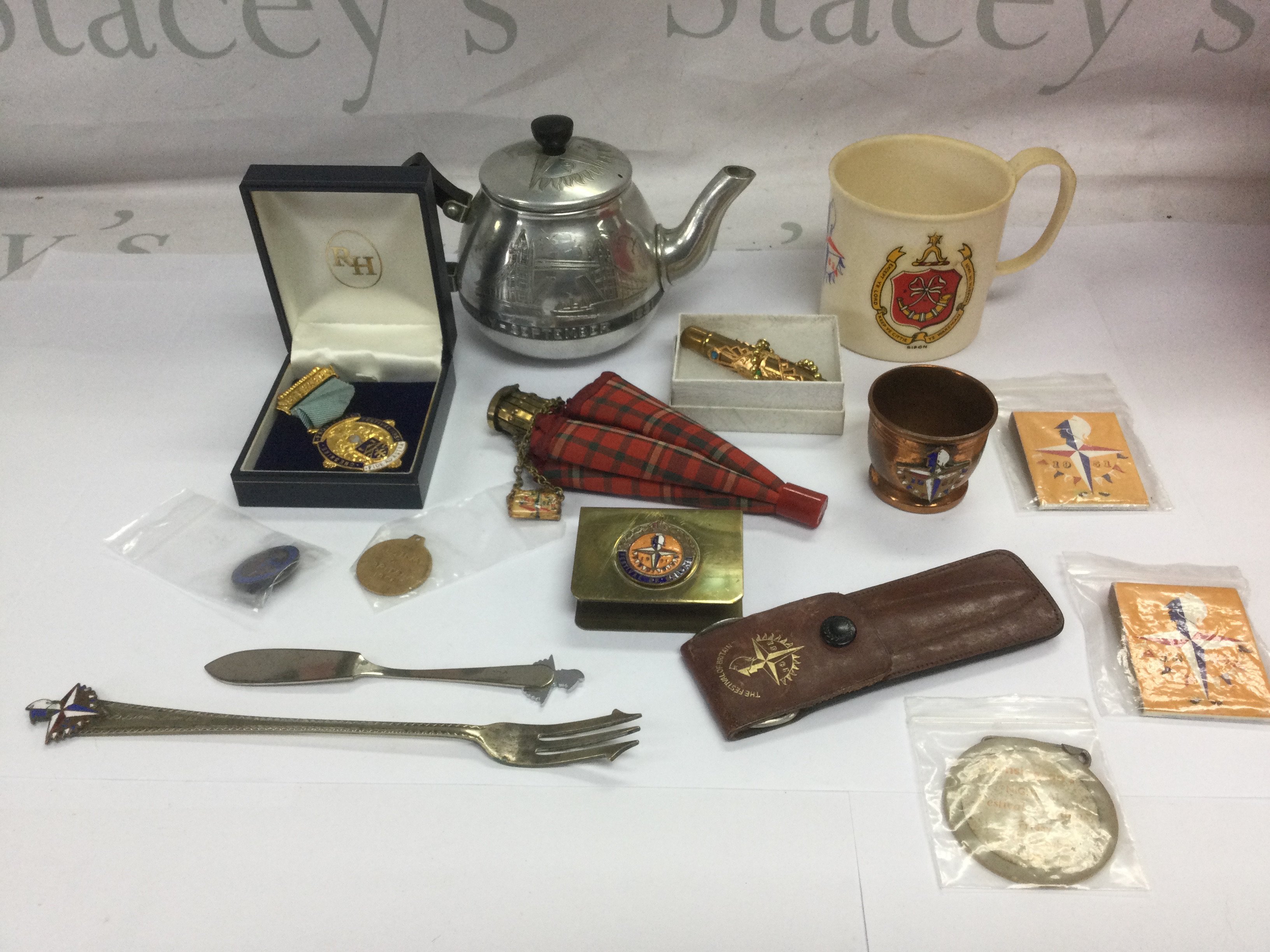A collection of Festival of Britain items comprising silk handkerchiefs, enamelled badges and various ephemera. Shipping category D.