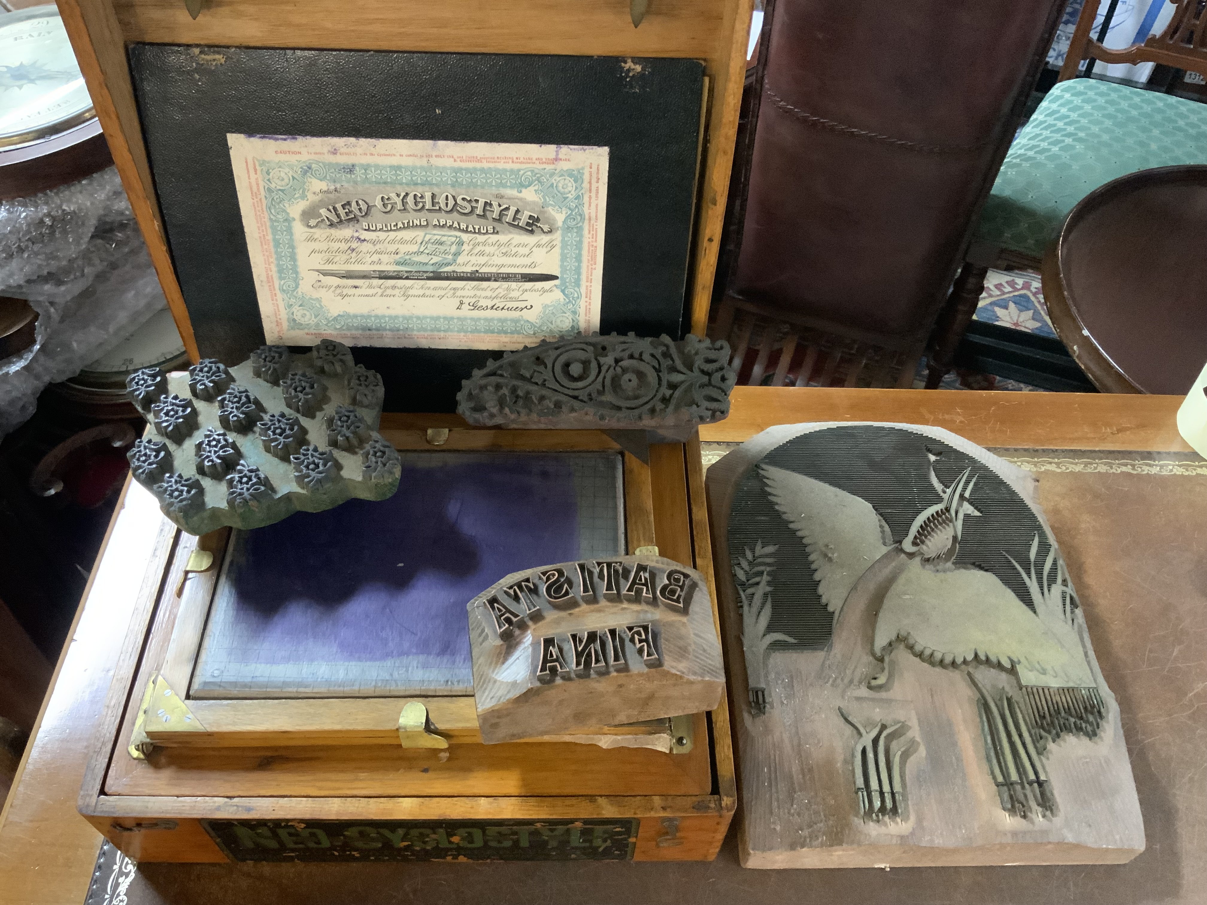 A vintage Neon Cyclostyle duplicator together with 4 large wooden print blocks.