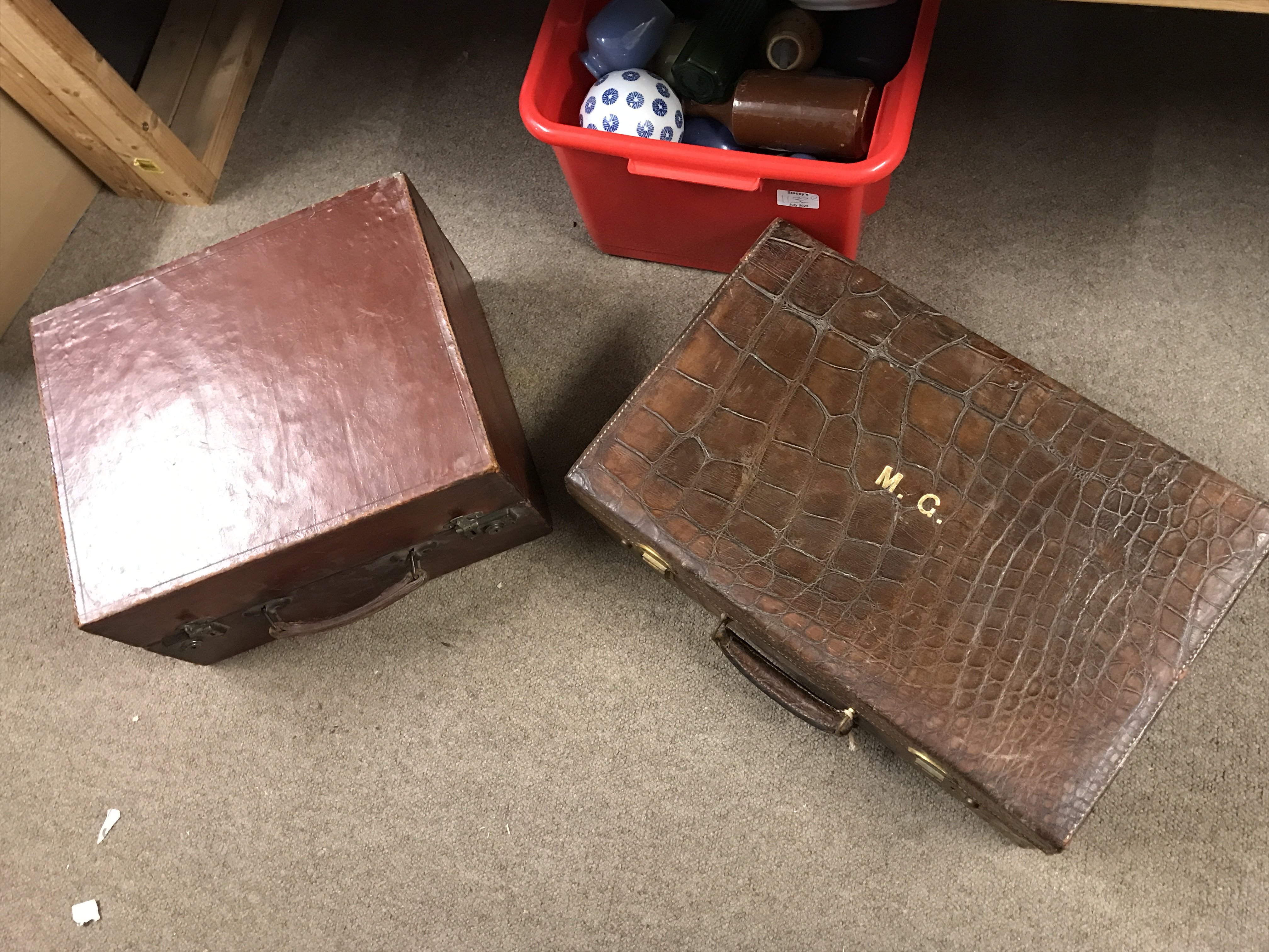 A leather case and a crocodile case, postage category C