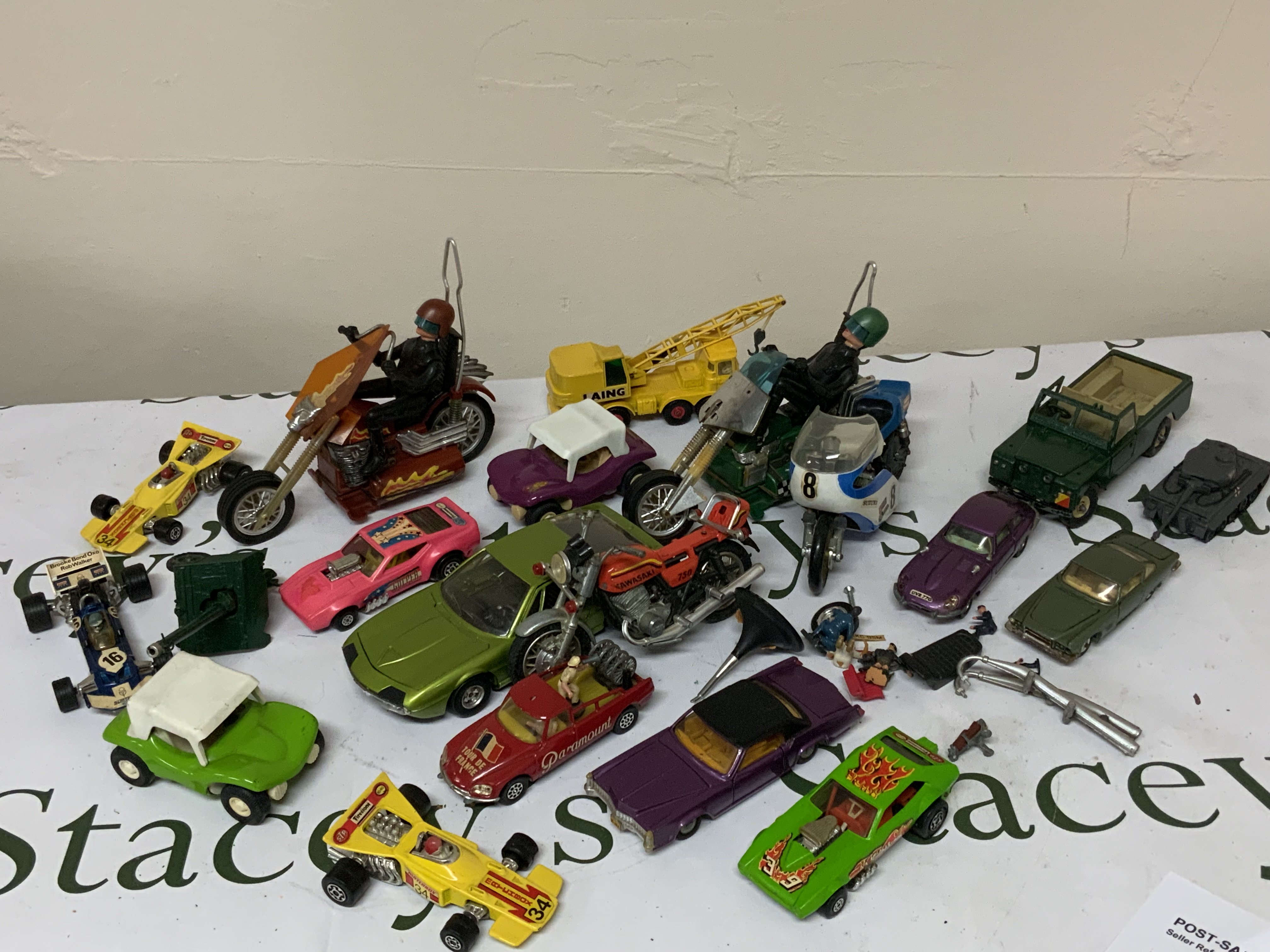 A mixed lot of play world diecast toys to include film and military examples.