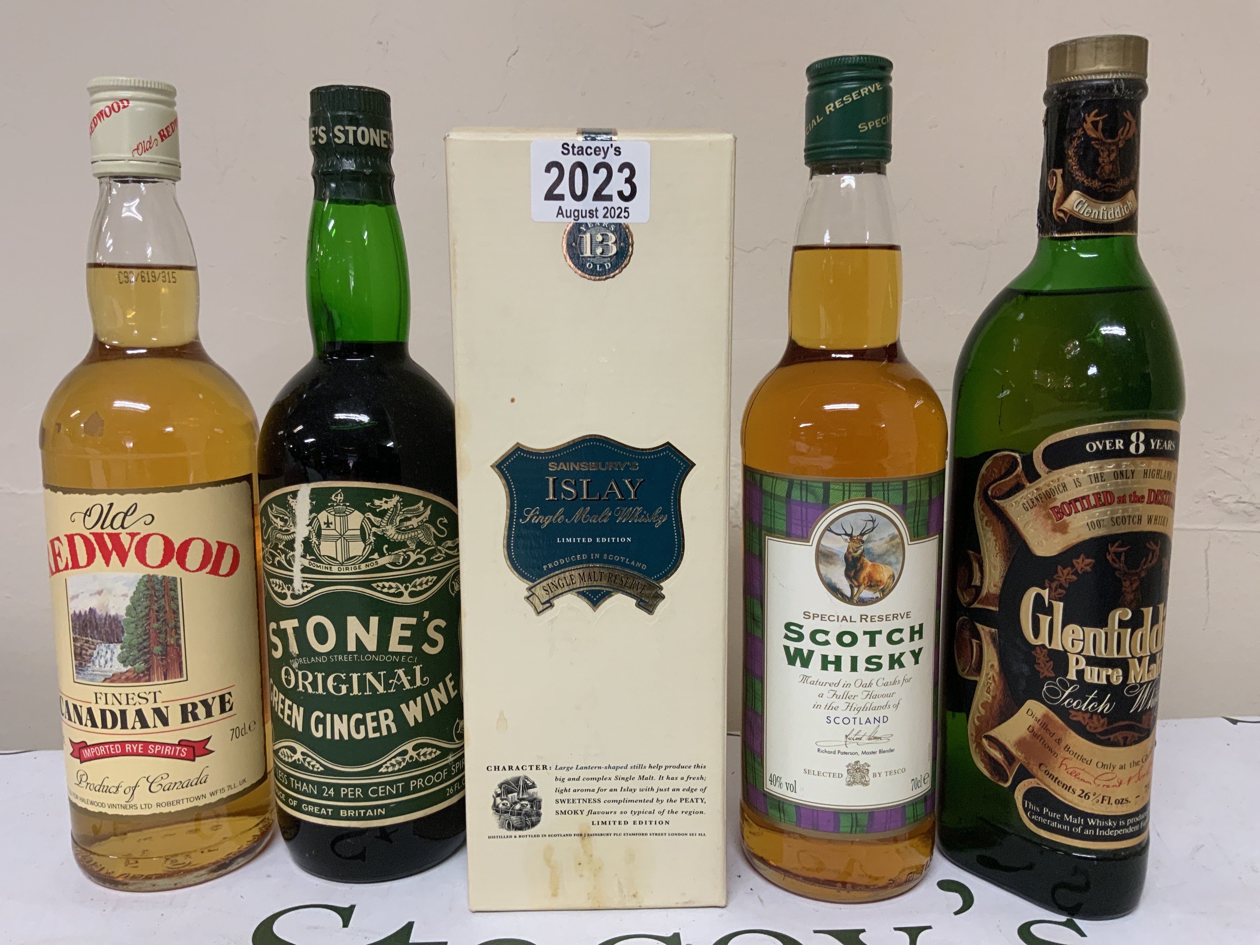 4 Various bottles of Whisky plus Stones Ginger Wine.