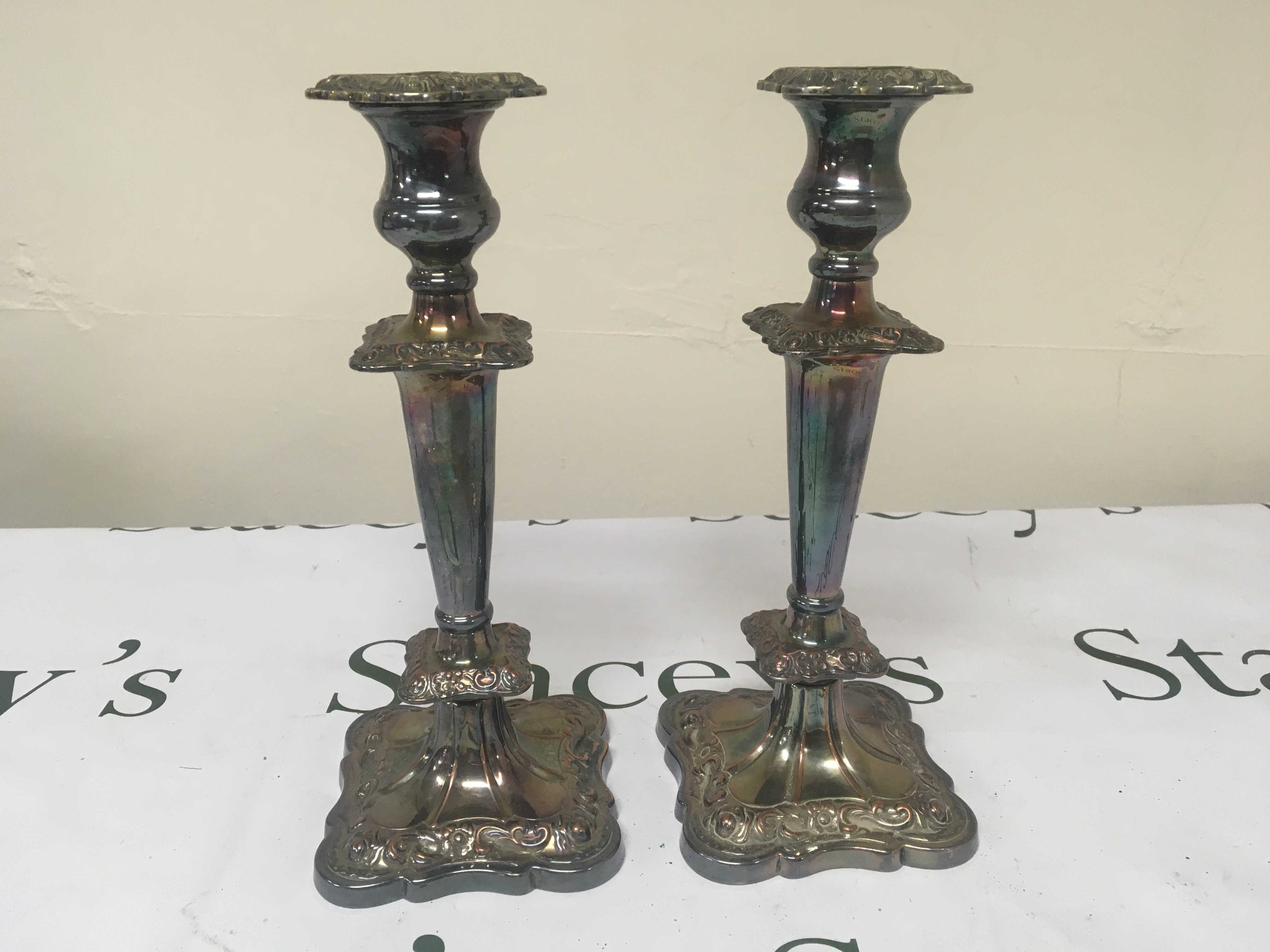 A pair of silver plated Candle sticks. Height 28cm