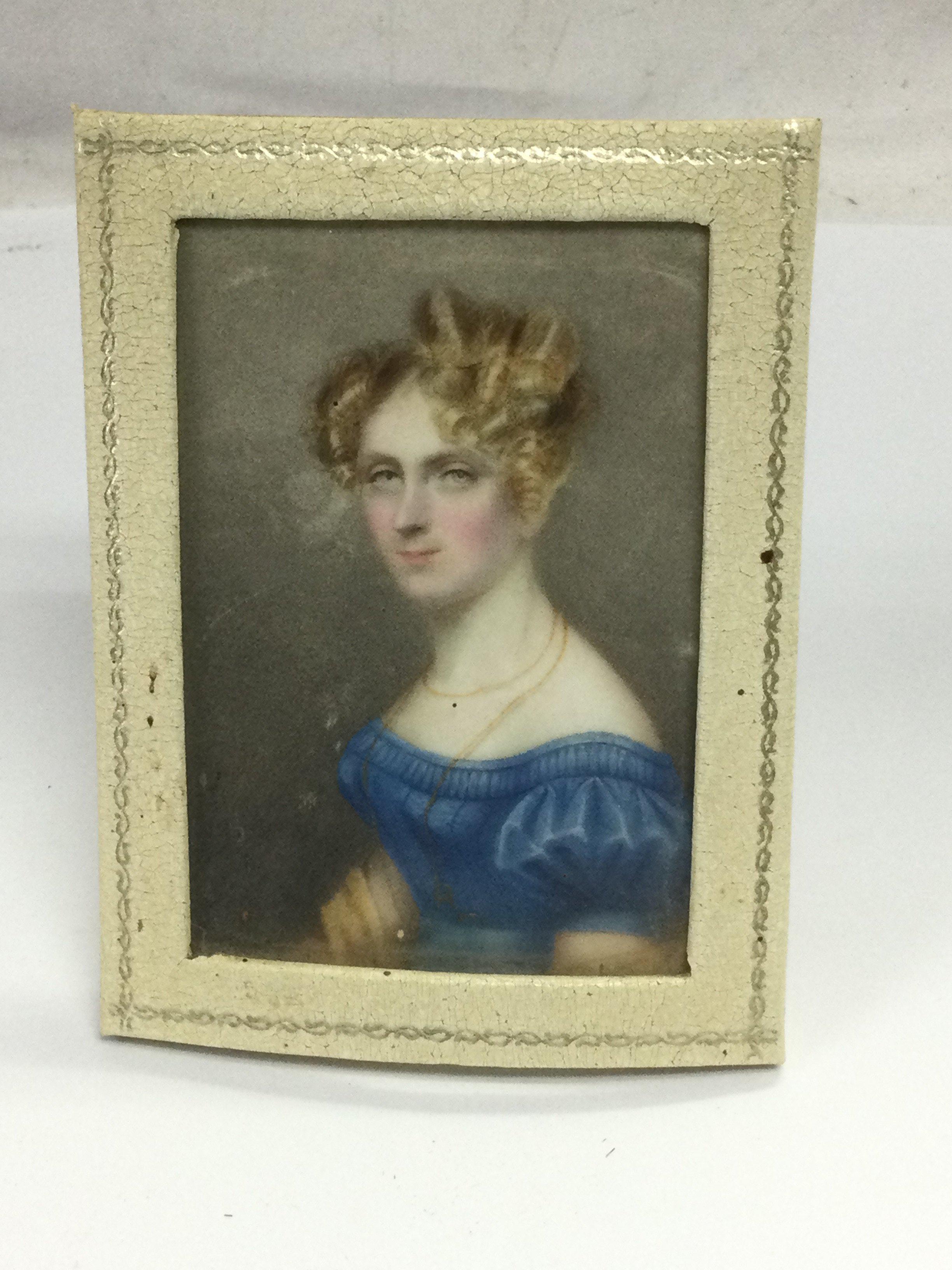 A small early 19th Century portrait miniature of a lady. Shipping category A.