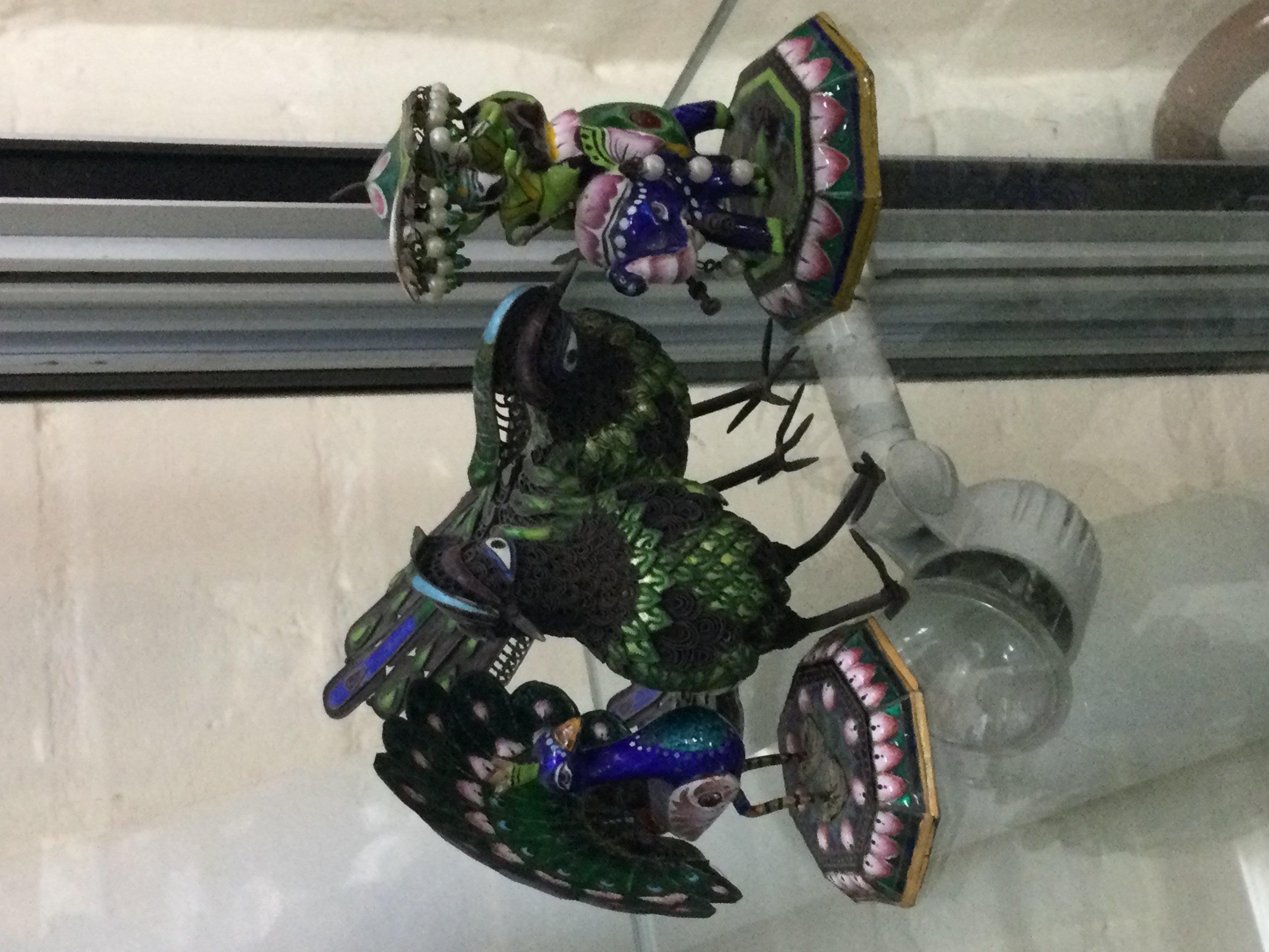 Four silver and enamel ornaments one in the form of a Elephant.