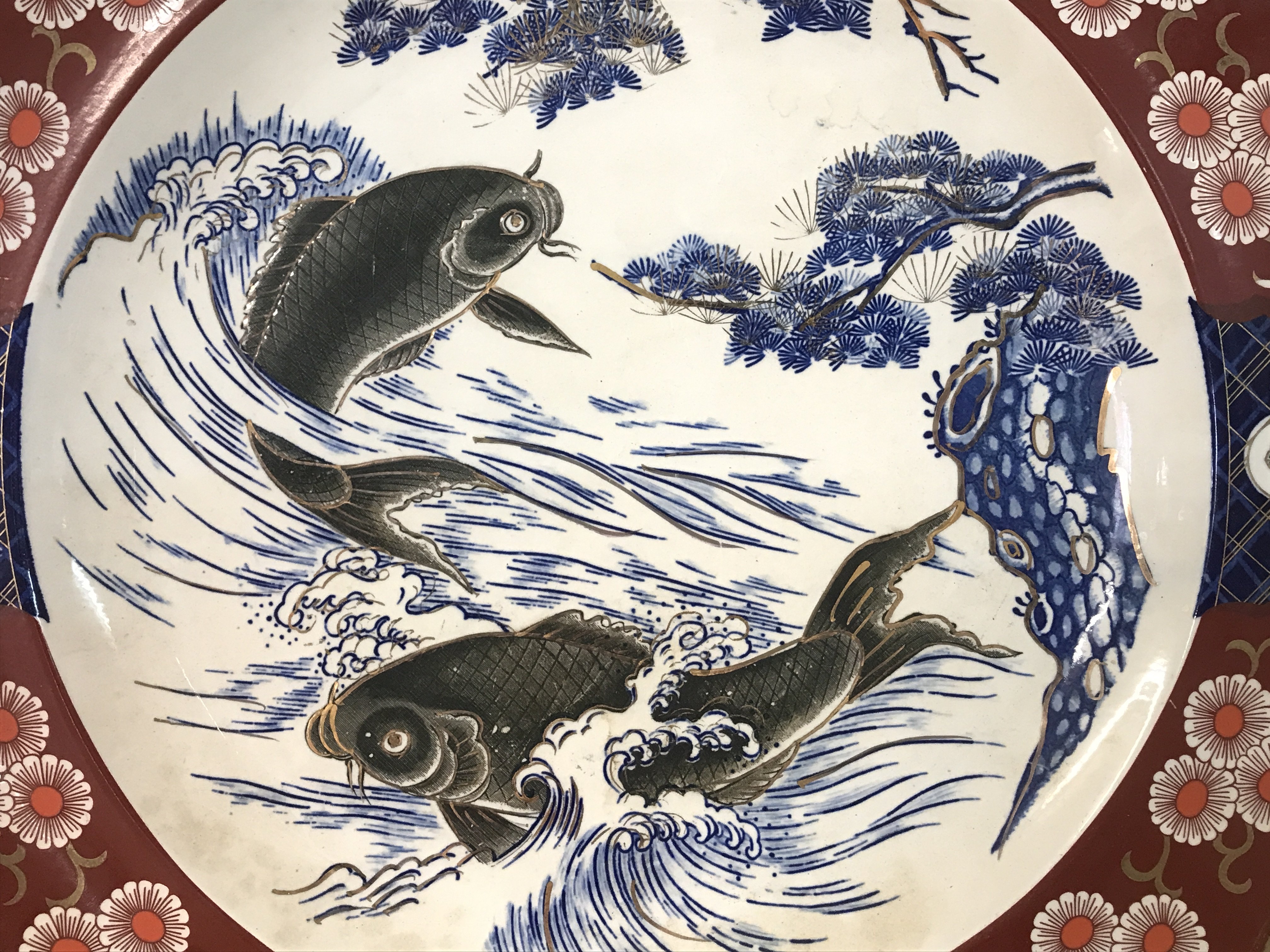 A large late 19th century Imari Koi charger. This lot cannot be posted.