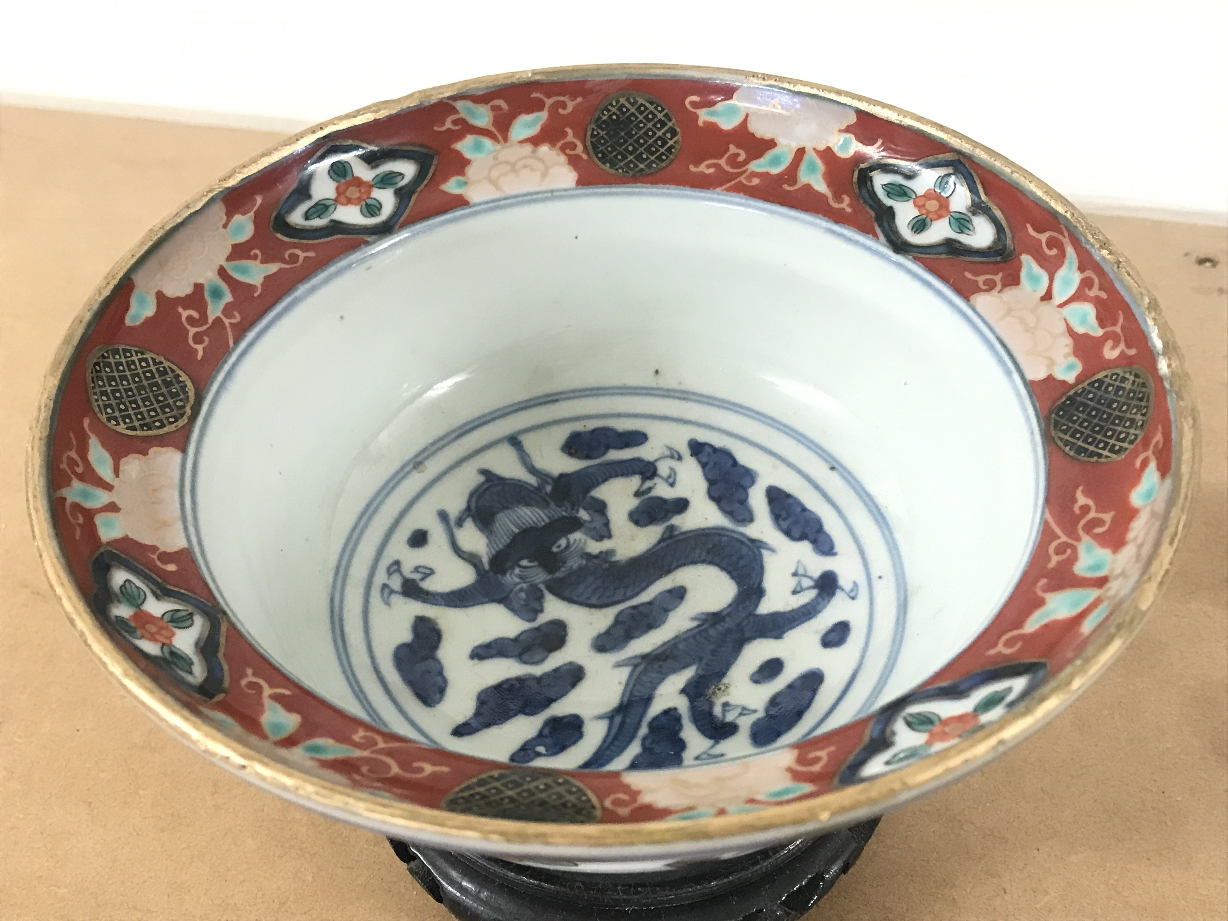 A Japanese Imari ware bowl with stand , 6 character mark at base. 8.5cm tall 18cm wide . This lot cannot be posted- NO RESERVE