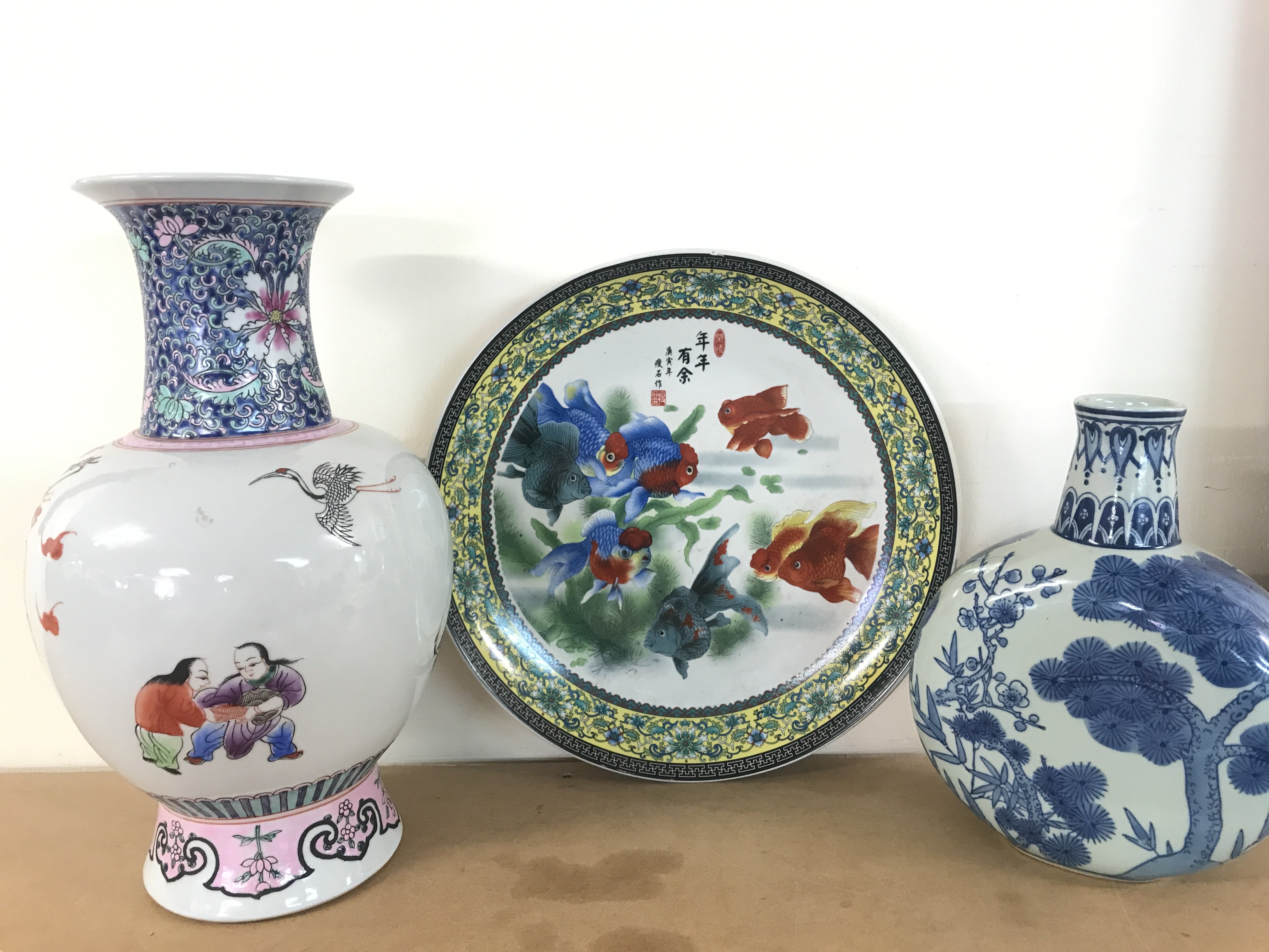 Chinese porcelain including a gold fish platter (34cm wide), a blue and white porcelain vase (25.5cm tall) with floral patterns and a Famille Rose vase (37.5cm tall). This lot cannot be posted- NO RESERVE